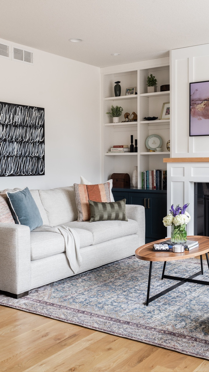 An open concept living room, grounded in neutrals with pops of color. Our #IGHnewbuild interior design project is a favorite for good reason. 🫶🏻 It’s a great example of how livable and approachable interiors do exist. All without the need for custom furniture or high-end anything. PS — the loloi area rug is on sale!

#LTKSaleAlert #LTKHome