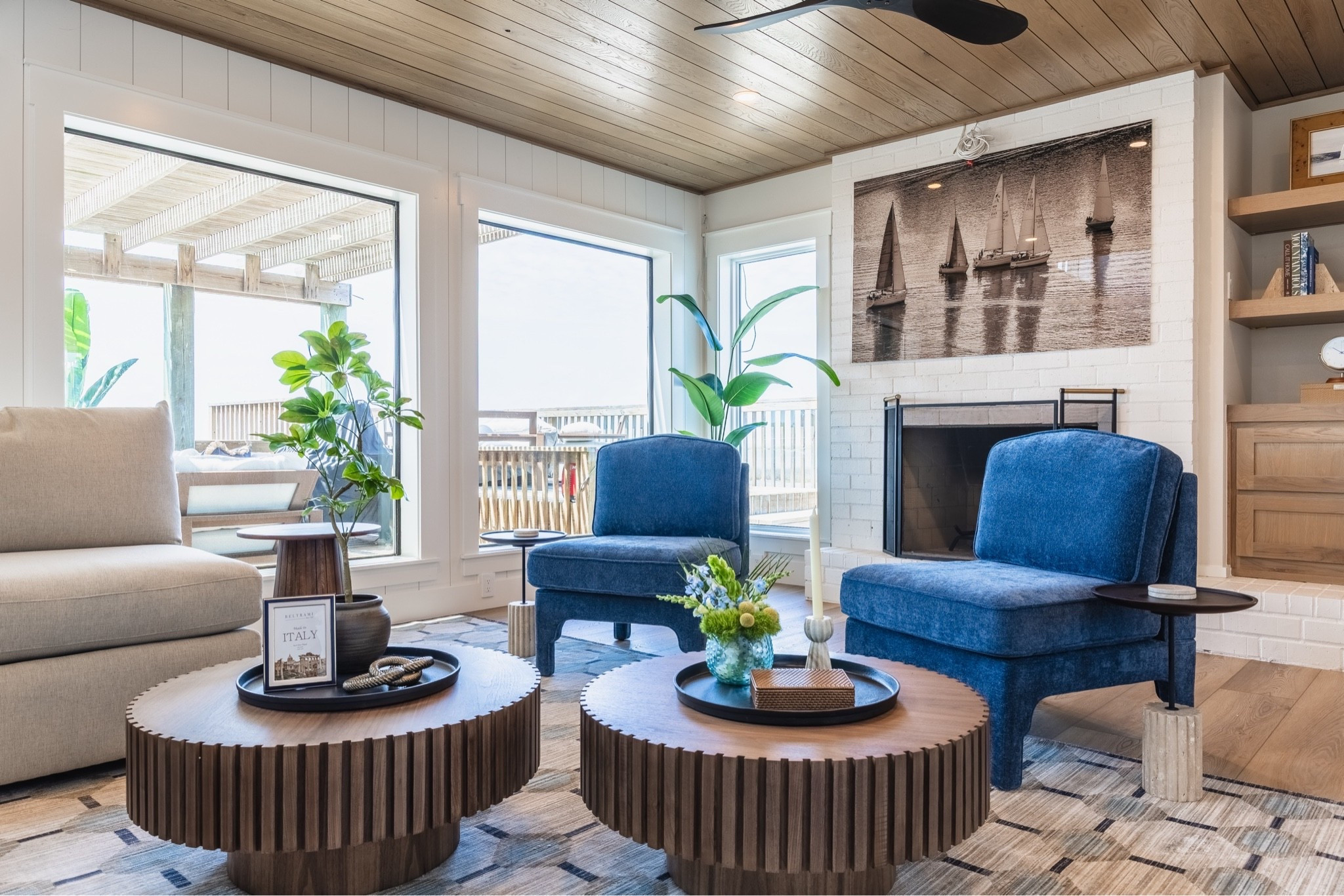 Designed to capture the ease of coastal living, this space layers warm wood tones, soft neutrals, and ocean-inspired blues for a look that feels both timeless and inviting. Natural light, thoughtful textures, and nautical details create the perfect balance of comfort and sophistication. 🌊🤍✨

#LTKSeasonal #LTKHome