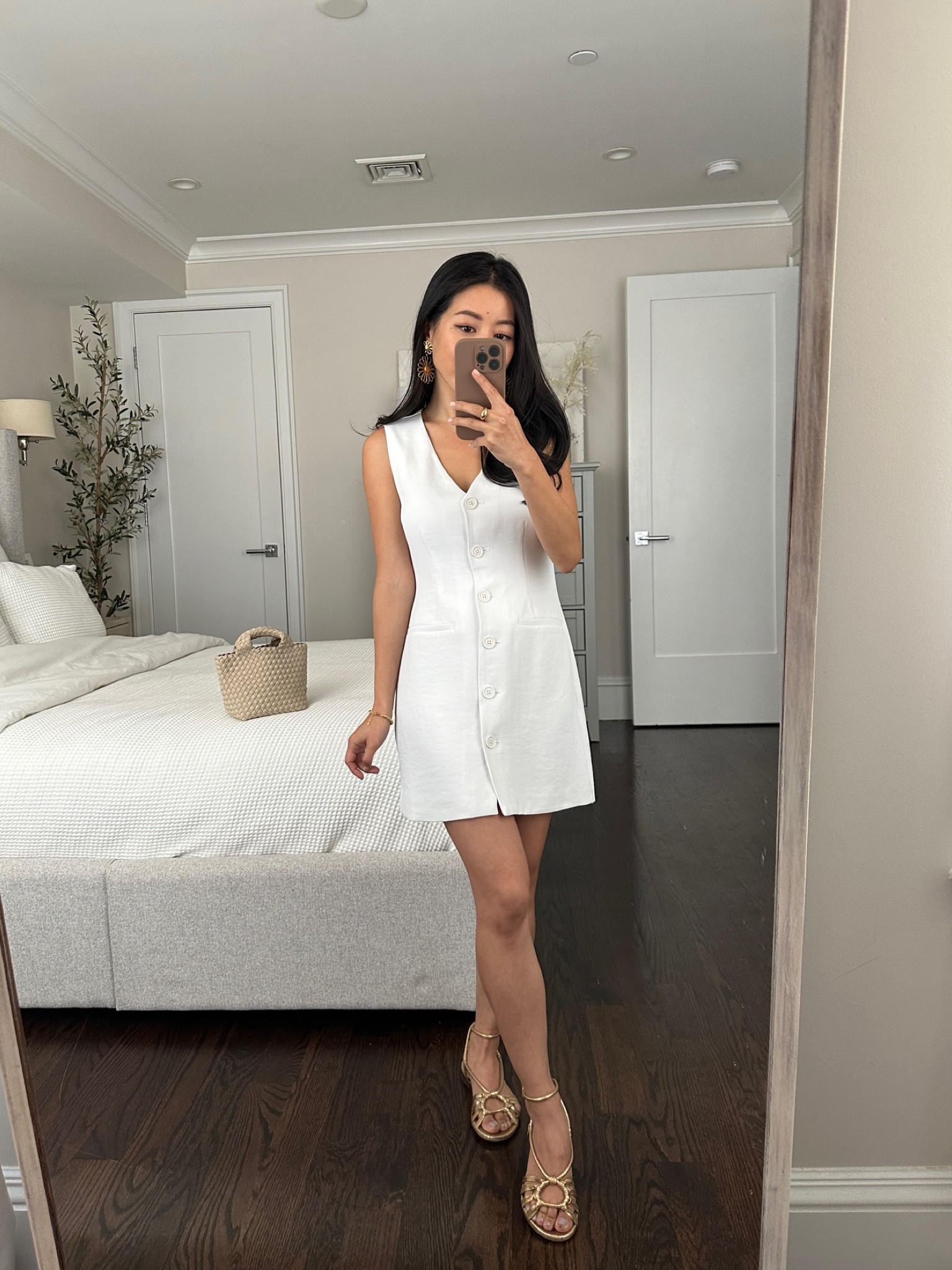 Abercrombie just released another version of a vest mini dress, so I linked this exact one as well as the newer similar style!

Loving vest dresses for a simple, classy outfit for vacations and Warner weather

• AF White vest mini dress xxs petite, I also tried this on in black layered over a top for cooler weather Fits me well, almost fitted at the bust but with room at the waist and hips

 • Sezane gold flat sandals 36

• Sezane flower earrings 

• Naghedi bag 

#petite warm travel outfits

#LTKSeasonal #LTKfindsunder100 #LTKtravel