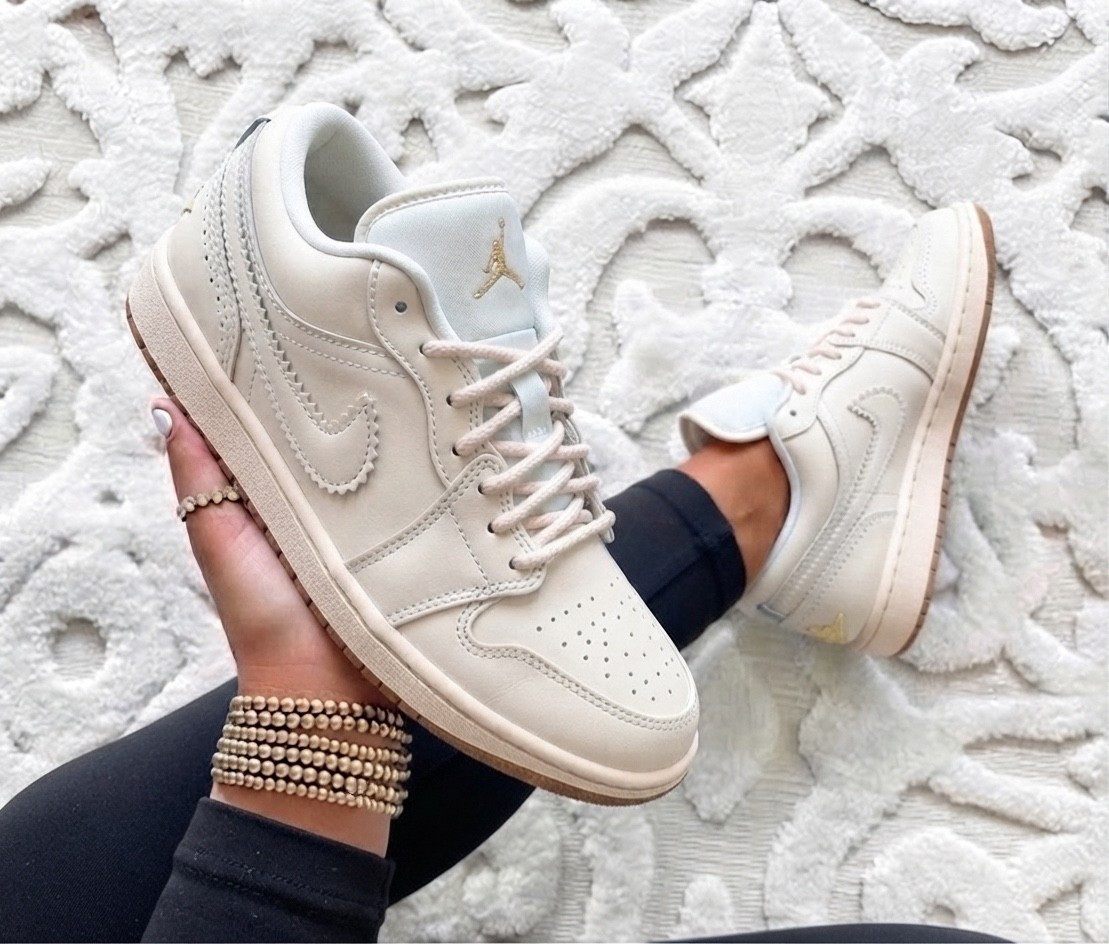 NIKE AIR JORDAN 1 LOW SE

🤍 If you’re looking for a sneaker that goes with literally everything, these are it. The creamy neutral colorway with the luxe gold Wings logo on the heel gives them such an elevated, chic look while still being super easy to wear every day. They’re perfect with denim, dresses, activewear, or your favorite matching set.

Fit: Runs true to size. If you have wider feet or prefer a little extra room, you may want to go up a half size.