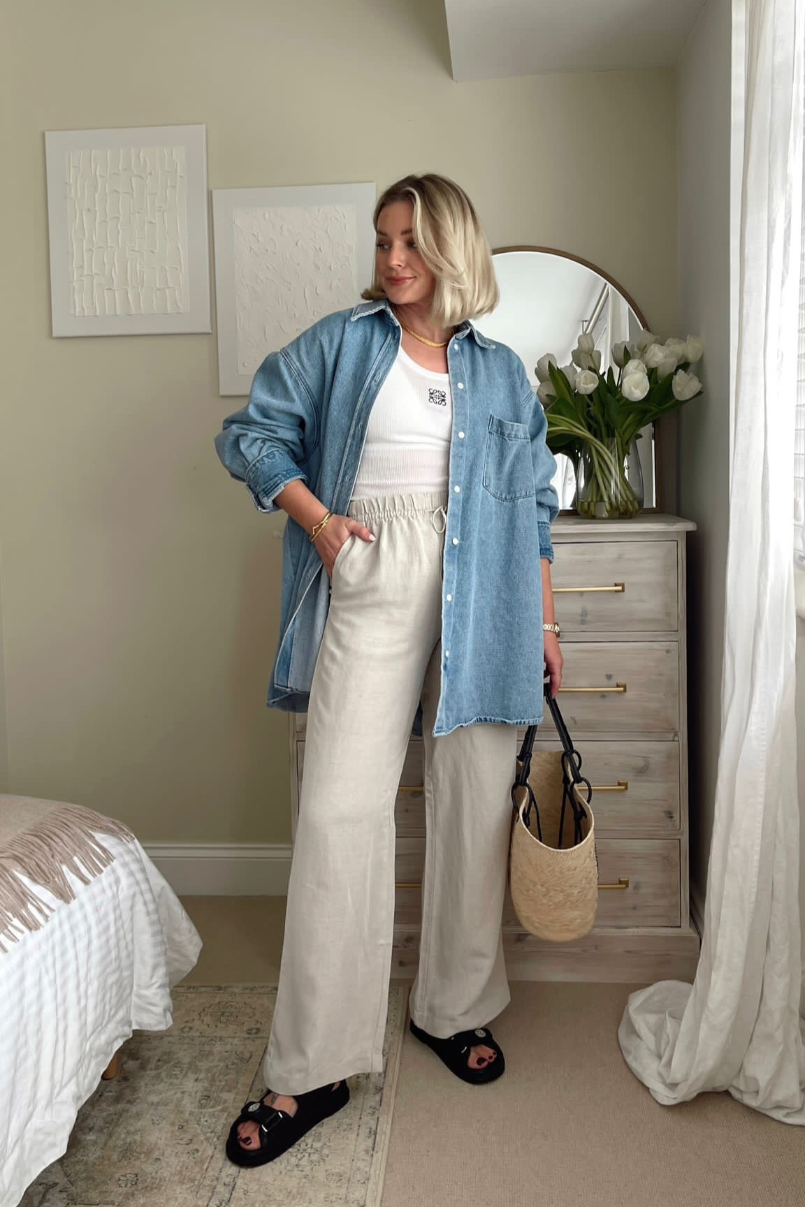 Spring summer outfit idea - Levi’s denim shirt, Loewe white vest top, H&M beige linen drawstring trousers, black dad sandals, basket bag  

#LTKSeasonal #LTKeurope #LTKstyletip