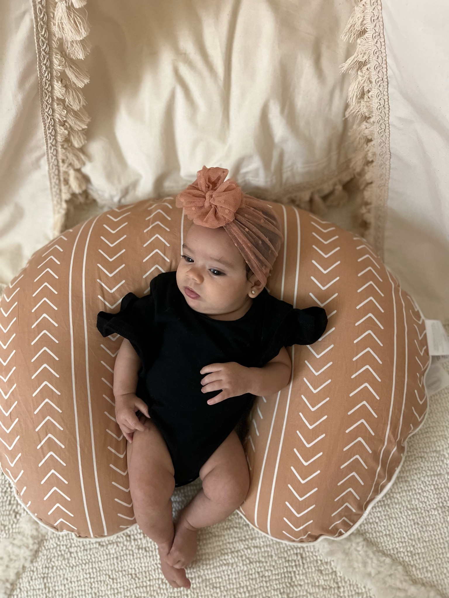 Boho baby girl lounging on her boppy 

#LTKbaby