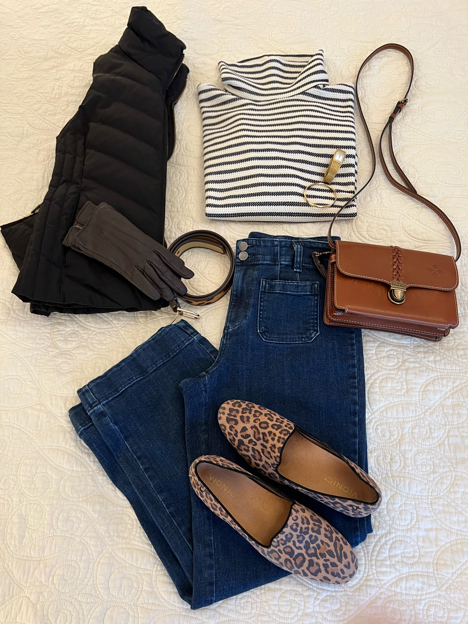 Perfect fall getaway look: If you’re an overpacker, this vest is for you! It’s REVERSIBLE. It can go from all black to leopard 🐆 just by turning it inside out. I love this because sometimes an all leopard 🐆 piece is a bit too much. Enter this vest. I mostly wear it with the black side showing. But I like having just a little bit of the leopard 🐆 edge show along the neckline and the front edges. It keeps me “on trend” without feeling overwhelmed by the 🐆print. I love it over this oversized waffle knit navy striped turtleneck. Great neckline! Not fussy! Just sharp! I repeated the licks of leopard 🐆 with the belt and the oh-so-comfy but still classy leopard @vionic flats. I wore a brown crossbody that is awesome! As well as a pair of pretty wide-leg dark wash denim @talbots jeans. Fun look! Very pulled together!

#LTKTravel #LTKSeasonal #LTKItBag