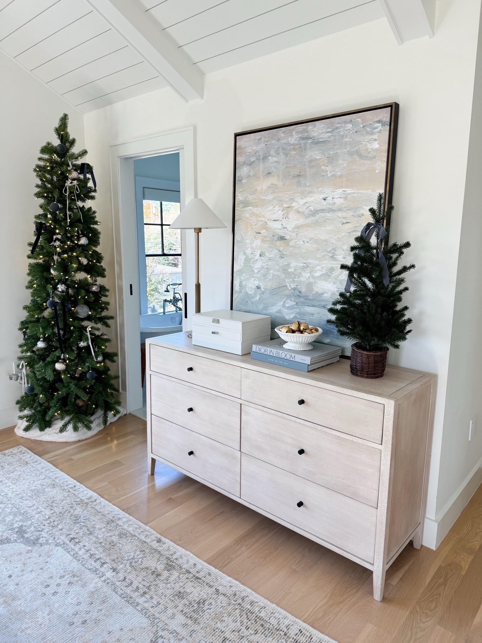 Simple styling of my bedroom with a narrow pre-lit pencil tree, glittering ornaments, pops of soft blue, and faux tabletop Christmas tree



#LTKSeasonal #LTKHome #LTKHoliday