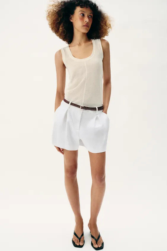 Mid-rise shorts with front pleats and belt. Front pockets and false back welt pockets. Front zip,... | Zara US