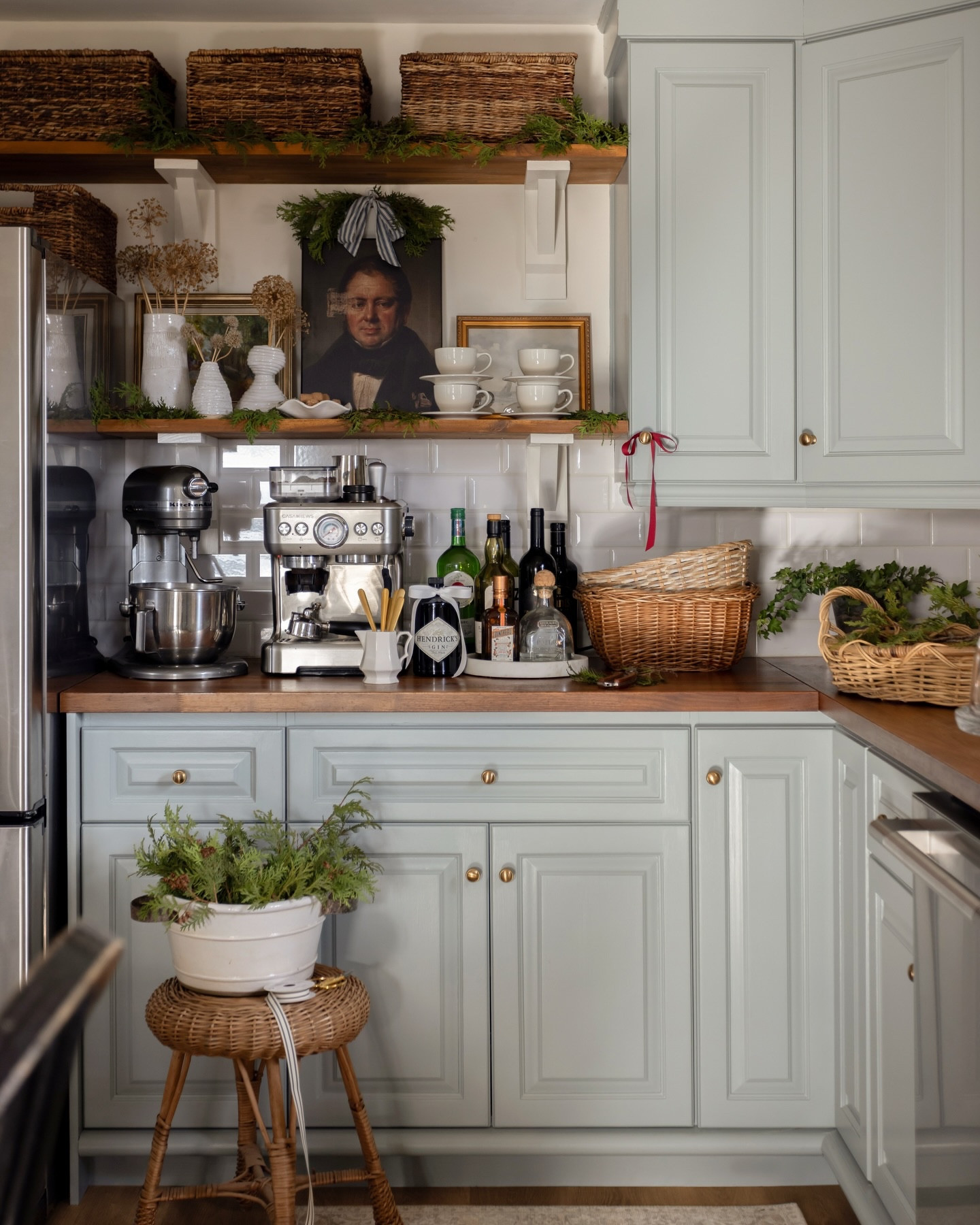 Still no regrets over these blue cabinets.🤍 Taking a solid moment of appreciation for my kitchen in all its cozy Christmas glory this year, and reveling just a little bit in the fact that this cabinet paint color didn’t turn out to be so crazy after all.

Canada-friendly decor sources paired with vintage finds - follow @creeklinehouse for more timeless ideas for your home and garden.

Cabinet color: @benjaminmoore Mount St. Anne
Wall color: Benjamin Moore White Dove
Rug: @Rugette (use code CREEKLINEHOUSE for 20% off)
Cafe curtains: @curtarra_curtains (use code CH12 for 30% off during Black Friday)
Faucet and hardware: @moeninc
Counters and sink: @ikeacanada
Portrait art: @oppositewall
Vases: @jules_love