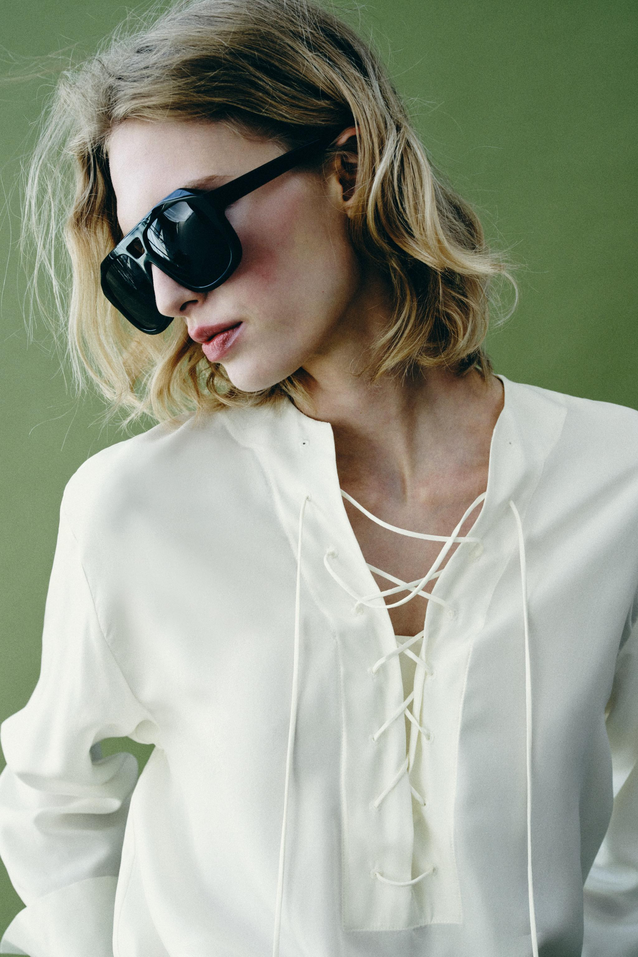 ZARA WOMAN COLLECTIONShirt with main fabric made of silk yarn. Adjustable V-neck with ties and lo... | Zara US