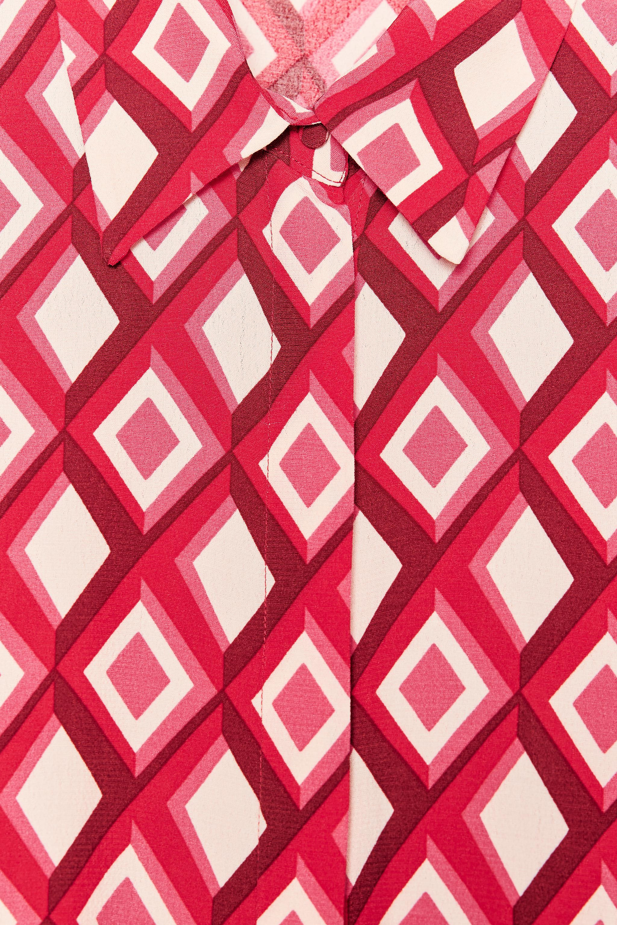 Shirt with lapel collar and long sleeves. Front hidden button closure. | Zara US