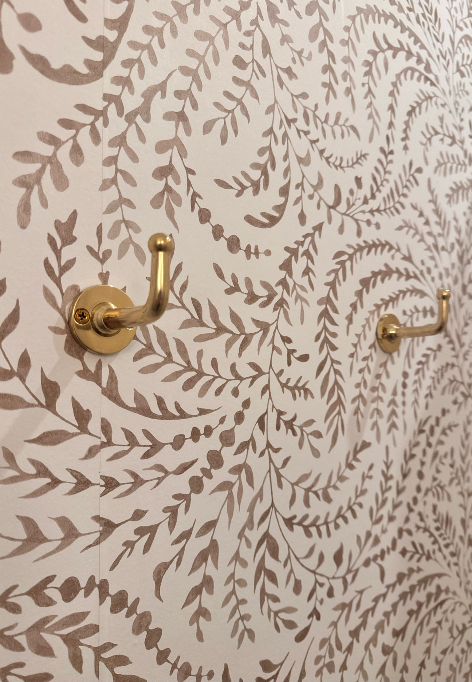 Brass Tobe hook under $25! Classic hook design. Bathroom design. CB2 wall hook. Wallpaper. Floral wallpaper. Taupe. Serena & Lilly 

#LTKStyleTip #LTKFindsUnder50 #LTKHome