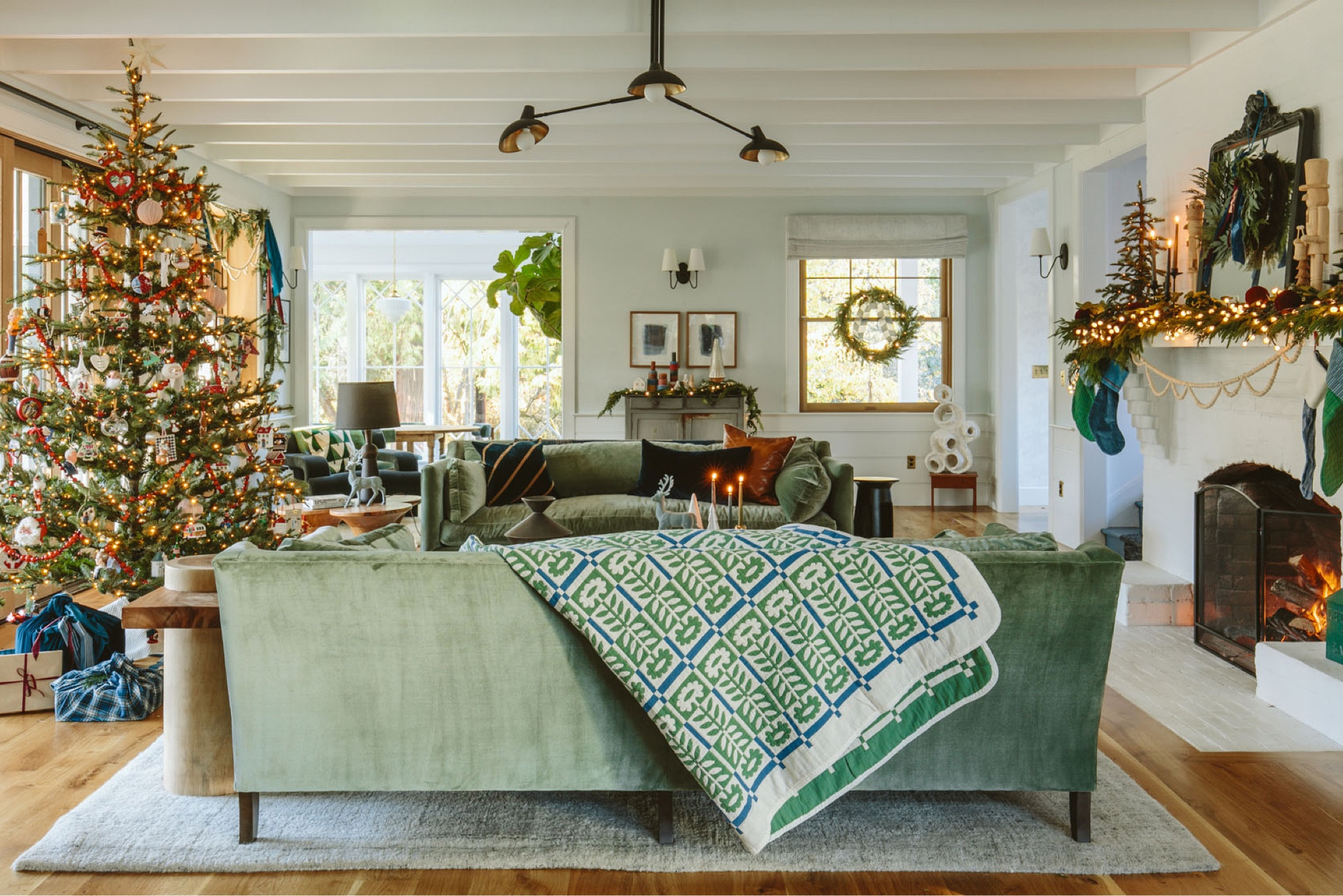 I’m committed to not doing anything too chic or sophisticated/neutral while the kids are still little (maybe ever). This is for them and they LOVE color. At the mountain house, where we typically spend Christmas we had one Scandi tree and one family tree, but here we have one (and yes, I shipped up all of my family ornaments, OF COURSE). So this year I really feel like I figured out how to bring in a lot of color and festivity while still stretching my creativity and working with the color palette of the room. As you can see it’s a bit Scandi (driven by that Schoolhouse Blanket and stockings that I’m obsessed with), still playful (a lot of color, especially the red on the tree) with some more stylized moments adding in dark mauves, aubergines, teals and blues.

#LTKhome #LTKfamily #LTKHoliday