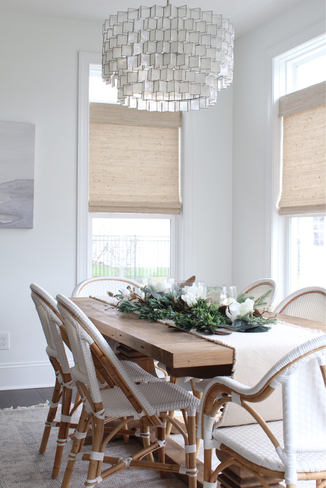 Coastal neutral dining room 

Riviera chairs, wood table, capiz chandelier, art, woven shades 

#LTKhome #LTKSeasonal #LTKHoliday