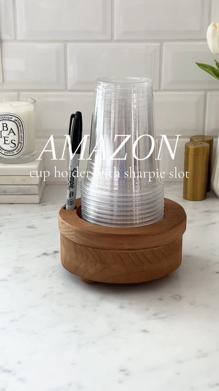 "Guess what, folks? 🎉 If there's one thing I love more than hosting a ton of cookouts, it's seeing everyone's smiling faces gathered 'round the grill! But let's be real, amidst the laughter and chatter, I am constantly misplacing my cup—like, every single time!
Grab Yours Here: https://amzn.to/4aQbXAL

That's why I just had to share my latest lifesaver: the Wooden Party Cup Holder with Marker Slot! Now, I can't promise I won't still lose my keys, but at least my cup conundrum is solved! All I had to do was stick a sharpie in the slot and fill it with plastic cups—easy peasy! 🖊️🥤 No more accidental cup swaps or guessing games about whose drink is whose. Plus, it adds a charming rustic touch to the party setup, don't you think?

So, next time you swing by for one of my legendary cookouts, fear not! Your cup will have a cozy spot to call home, and you'll be sipping in style all evening long. Cheers to good times and even better company! 🍔🥤#cookout #backyardbbq #backyardcooking #grillingseason #grillingandchilling #amazonfinds #founditonamazon #amazonfind

#LTKVideo #LTKSeasonal #LTKhome