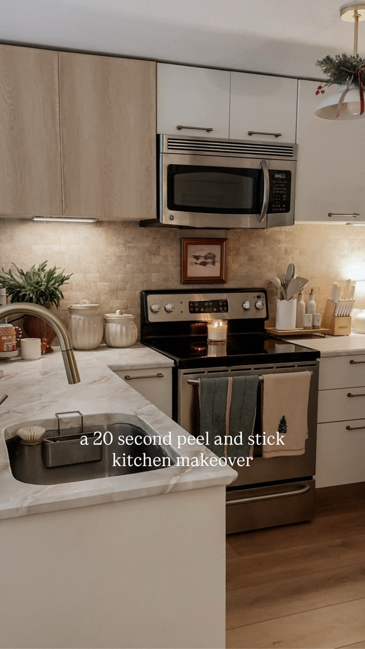 I can’t believe I did all this with peel & stick… 👀✨ 

Here’s everything I used and what I learned:

– Peel & stick countertop that looks like Taj Mahal marble
– Peel & stick backsplash with a pretty stone-like texture 
– Peel & stick wood-look wallpaper for:
• the side of my fridge facing the entryway
• the two clear accent cabinet doors
This one was trickier - the adhesive isn’t as strong and corners/edges were tough since the material is stiffer.

I also:
– Updated the outlets
– Swapped in a new kitchen faucet
– Used grout to camouflage small imperfections in the backsplash
– Added sealant around the wallpaper edges near the sink

Cutting the countertop vinyl around the sink was  the hardest part for me, and it is far from perfect lol. But this was a true DIY experiment - no tutorials, no prior experience with peel & stick, never changed an outlet or faucet before - and I’m honestly so proud of how it turned out. It’s a massive improvement.

For maintenance:
I’m being gentle with it - trivets, coasters, wiping spills immediately, and never cutting on the surface. I’ll keep you posted on durability, but if someone experienced installed this for me, I’m pretty sure it would look insanely perfect and last even longer.

Since my full kitchen remodel is around the corner, perfection wasn’t the goal - seeing a transformation was. And wow… it made such a difference. ✨

#renovationproject #homerenovation #diyhome

#LTKHome