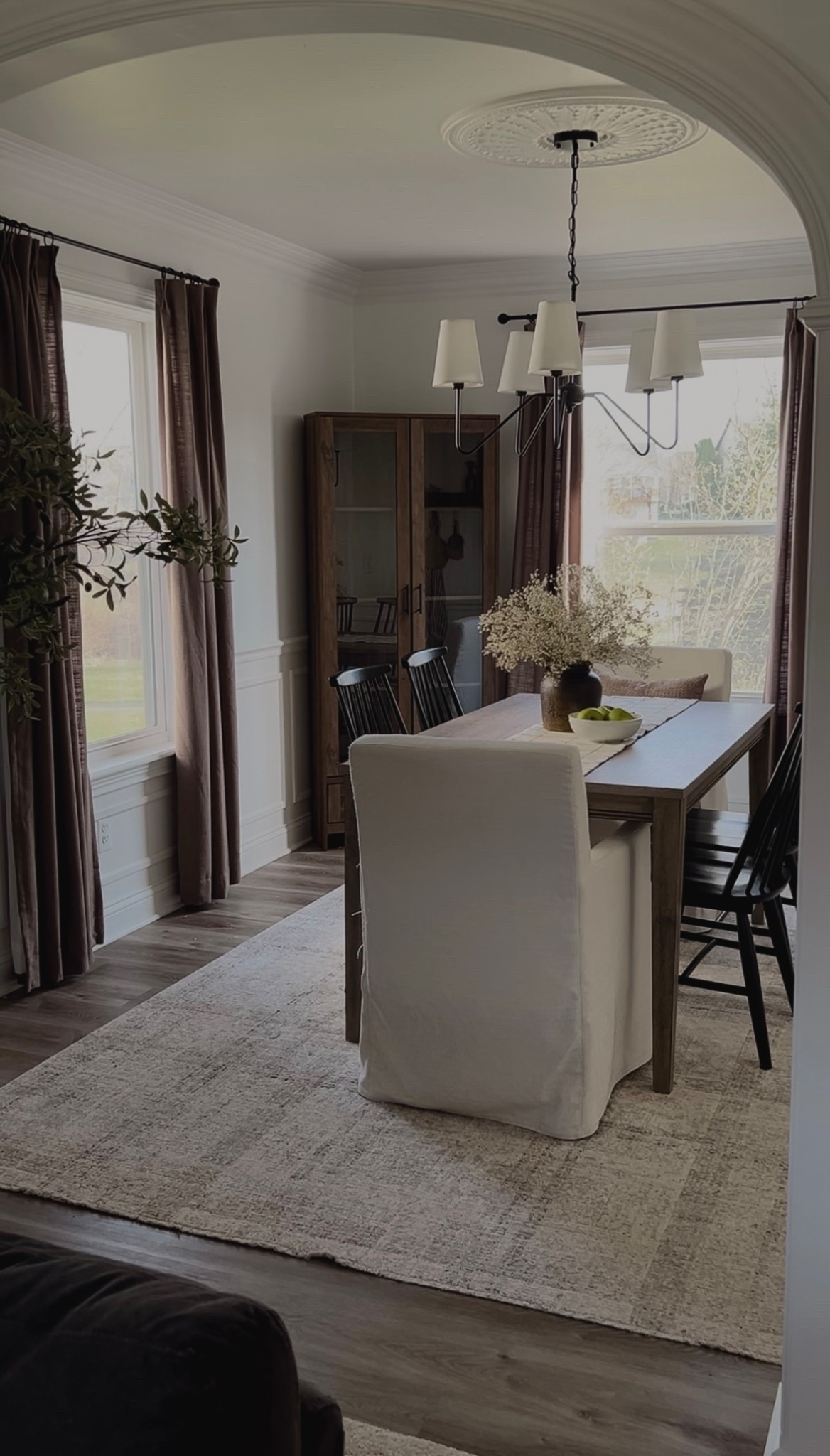 Dining room decor, neutral dining room finds, wooden hutch, dining room hutch, dining room table, white dining chairs, black dining chairs, dining room rug, area rug, neutral rug, Loloi rug, dining room curtains, accent curtains, Two Pages curtains, Amazon finds, Target finds, Wayfair finds, dining room light, dining room chandelier 

#LTKHome #LTKSaleAlert #LTKFindsUnder100