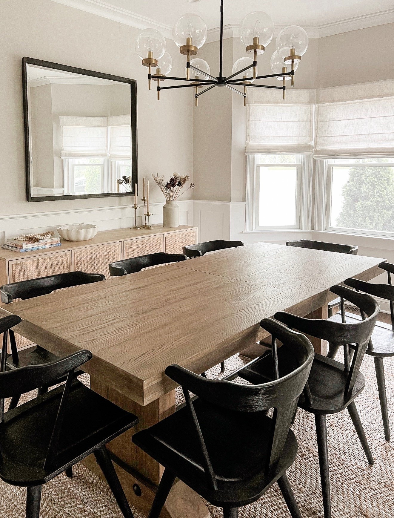 If you’re looking for one place to make a design statement, start with the dining room lighting. This chandelier instantly draws your eye in and sets the tone for the entire space. I love the mix of black metal, warm brass accents, and oversized glass globes, it feels timeless, elevated, and just the right amount of dramatic.

dining room lighting, chandelier, statement lighting, dining room design, home decor, interior design, lighting inspiration, glass globe chandelier, neutral home, timeless interiors, girlonthehudson

#LTKHome #LTKSeasonal