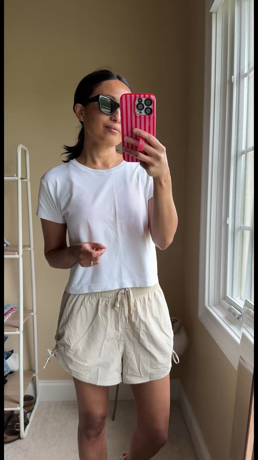 Everyday athleisure outfit for running errands. 
- One of my all-time favorite sport shorts came out with the cute ruched side-tie version. On sale 40% off. I also have them in black and wore them lots for walking and exploring on our last vacation. True to size. 
- I like tops like this that hit near your waist with a relaxed fit. Linking options. 
- Sneakers have been popular and found them restocked in this exact color. True to my Euro size. 
- Good quality sunglasses in a chic shape. 
- Sling bag style is available in multiple colors and is perfect for active days or travel.

#LTKOver40 #LTKActive #LTKTravel