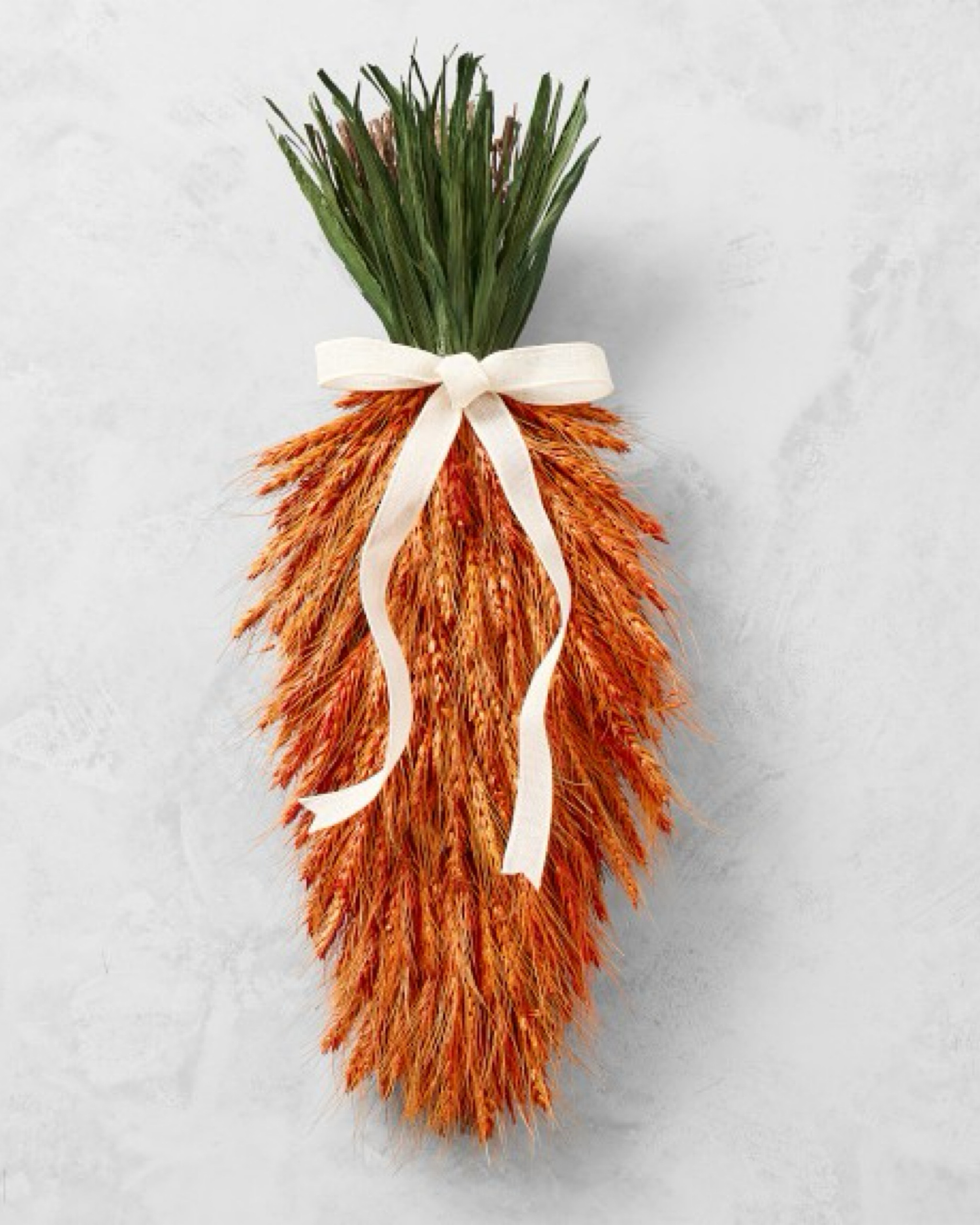 This beautiful carrot wreath is handcrafted with real dried wheat and corn husks. Its rich natural textures and vibrant color are perfect for Easter or spring decor.

#LTKSeasonal #LTKhome #LTKparties