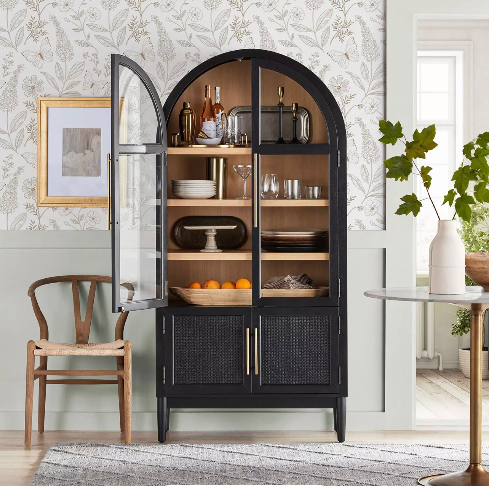 Member's Mark Enzo Bookcase Storage Cabinet With Rattan Cabinet Doors, Black Finish

Multi-functional arch cabinet offers an abundance of storage from books to fine China
Durable solid wood frame and stylishgrained veneers
Stylish antique gold hardware
Sherwin Williams® matte black finish on exterior and natural finish on cabinet interior
Upper doors feature tempered glass

#LTKhome #LTKstyletip #LTKFind