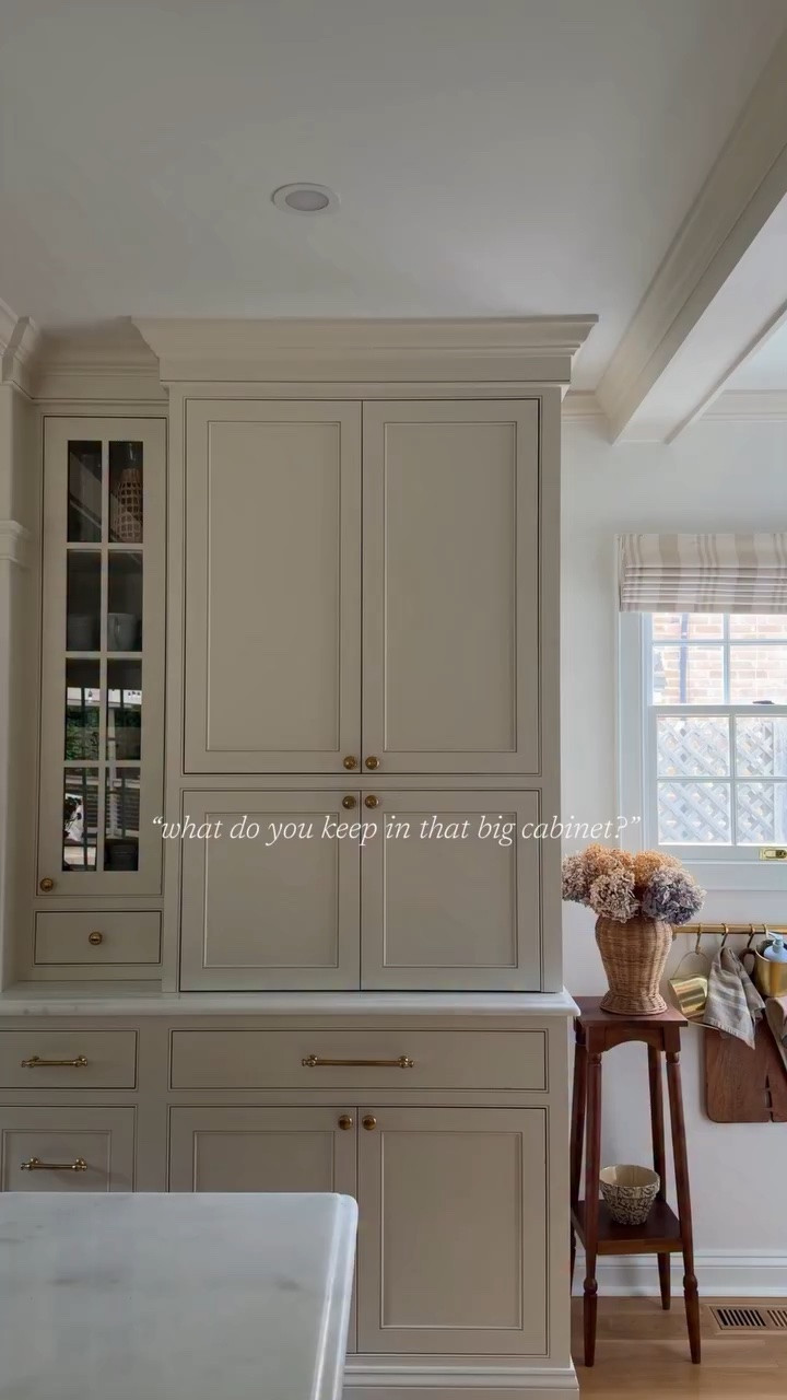 One thing we intentionally designed the kitchen around was having one hard-working cabinet that could hold the real life appliances we use constantly without taking over the counters.

The lower pull-outs house our larger everyday coffee maker and air fryer, so they’re easy to use, easy to tuck away, and don’t require rearranging the entire kitchen to use them.

Above, we keep all of the smaller appliances and gadgets in one dedicated spot: the KitchenAid mixer, blender, hand mixers, random attachments, and all the little things that somehow multiply over time.

It’s one of those behind-the-scenes decisions that has made the kitchen function so much better day to day while still keeping everything feeling calm and uncluttered.

If you’re looking for other kitchen details and sources, comment SHOP and I’ll send everything over!

 #cottagekitchen #kitchenrenovation #kitchencabinetry #traditionalhome #homebeforeandafter