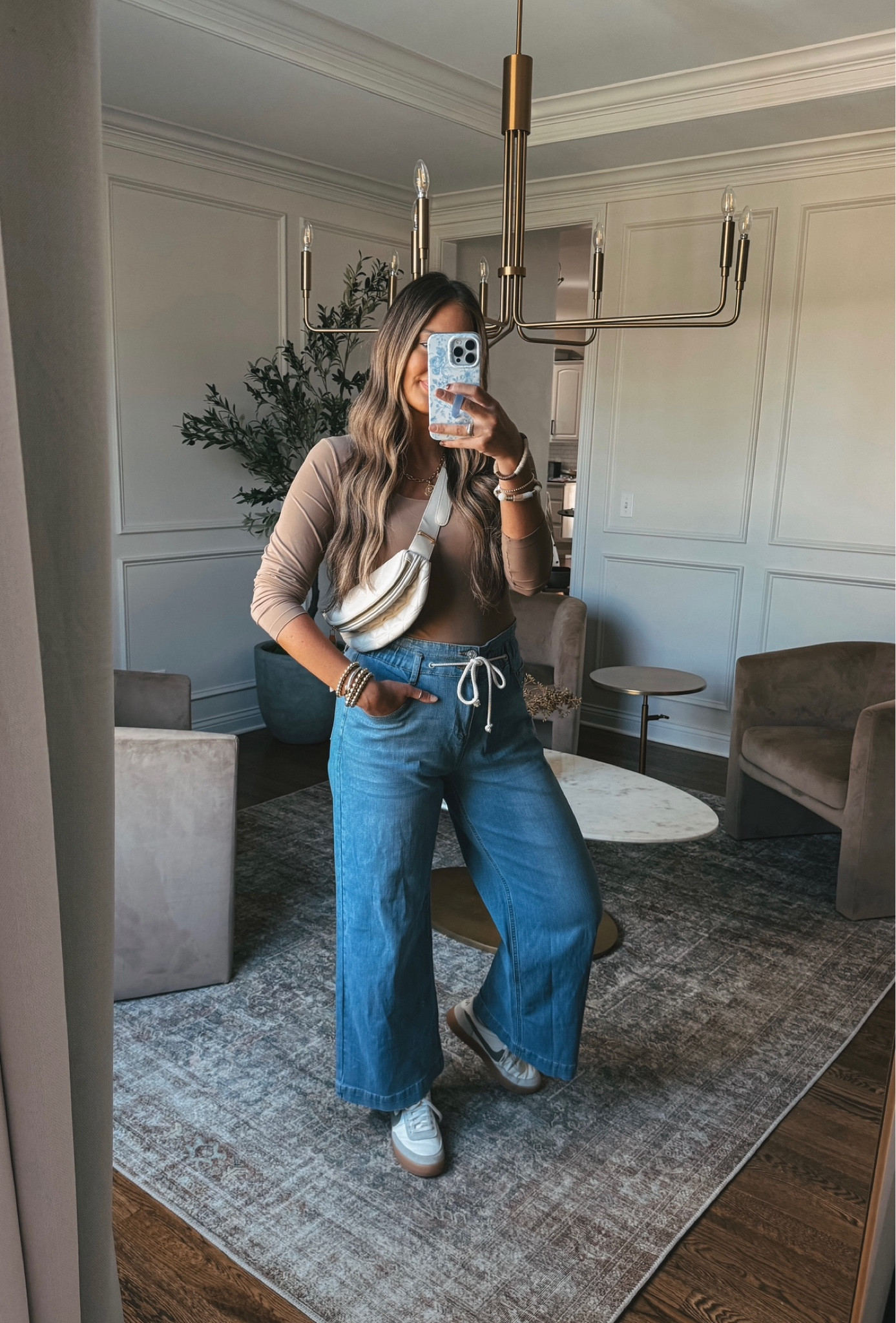 Wide leg jeans I've been loving postpartum!! Paired with a neutral bodysuit and my favorite casual sneakers 

#LTKFindsUnder50 #LTKStyleTip #LTKShoeCrush