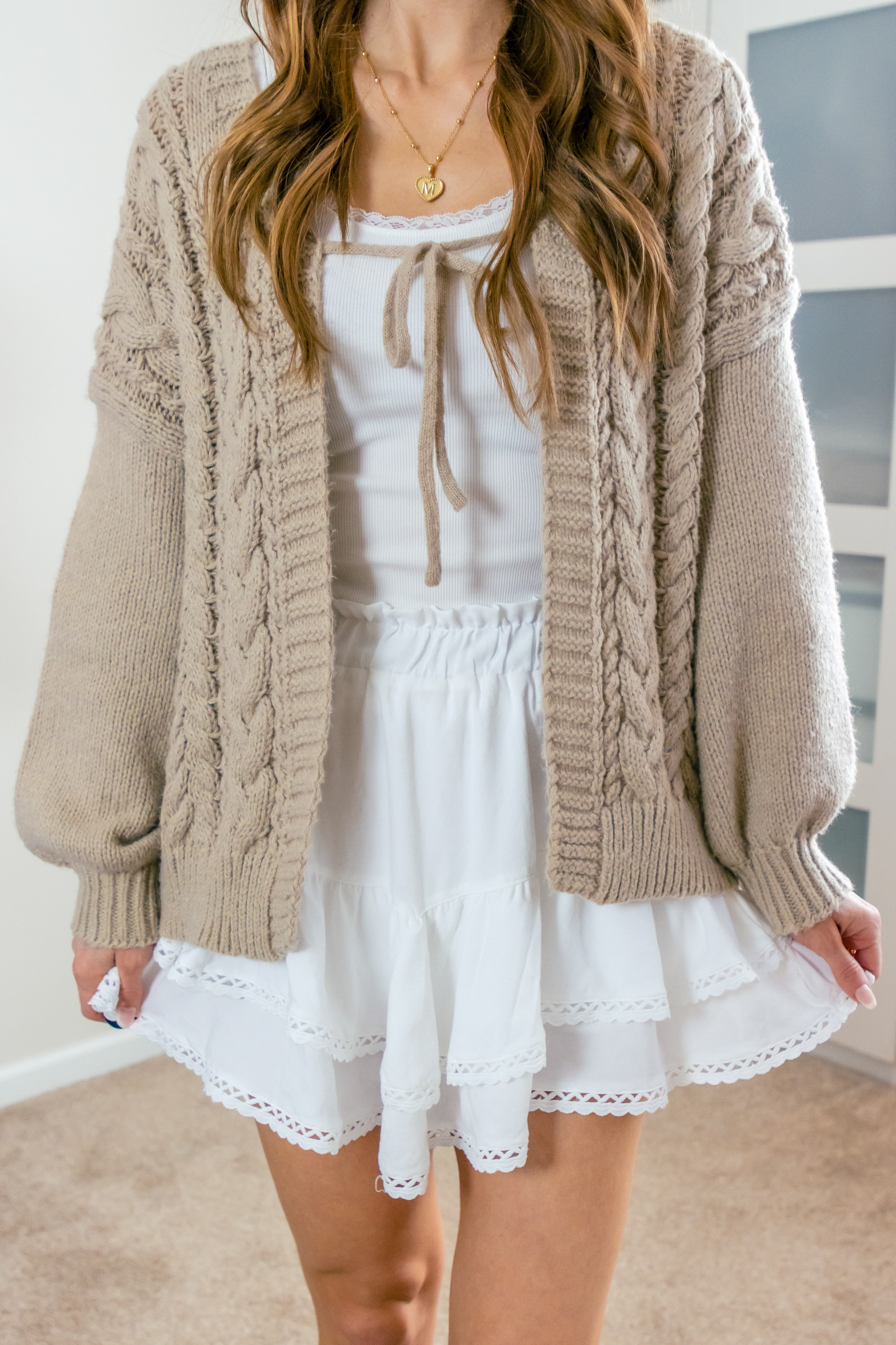 I'm obsessed with this cozy tie front cardigan! Pair it with a camisole for a relaxed vibe or a skirt for a dressier look. Perfect for any occasion! 
>> I'm wearing a size medium in the khaki color.
 

 #LTKootd #LTKSeasonal #LTKSaleAlert