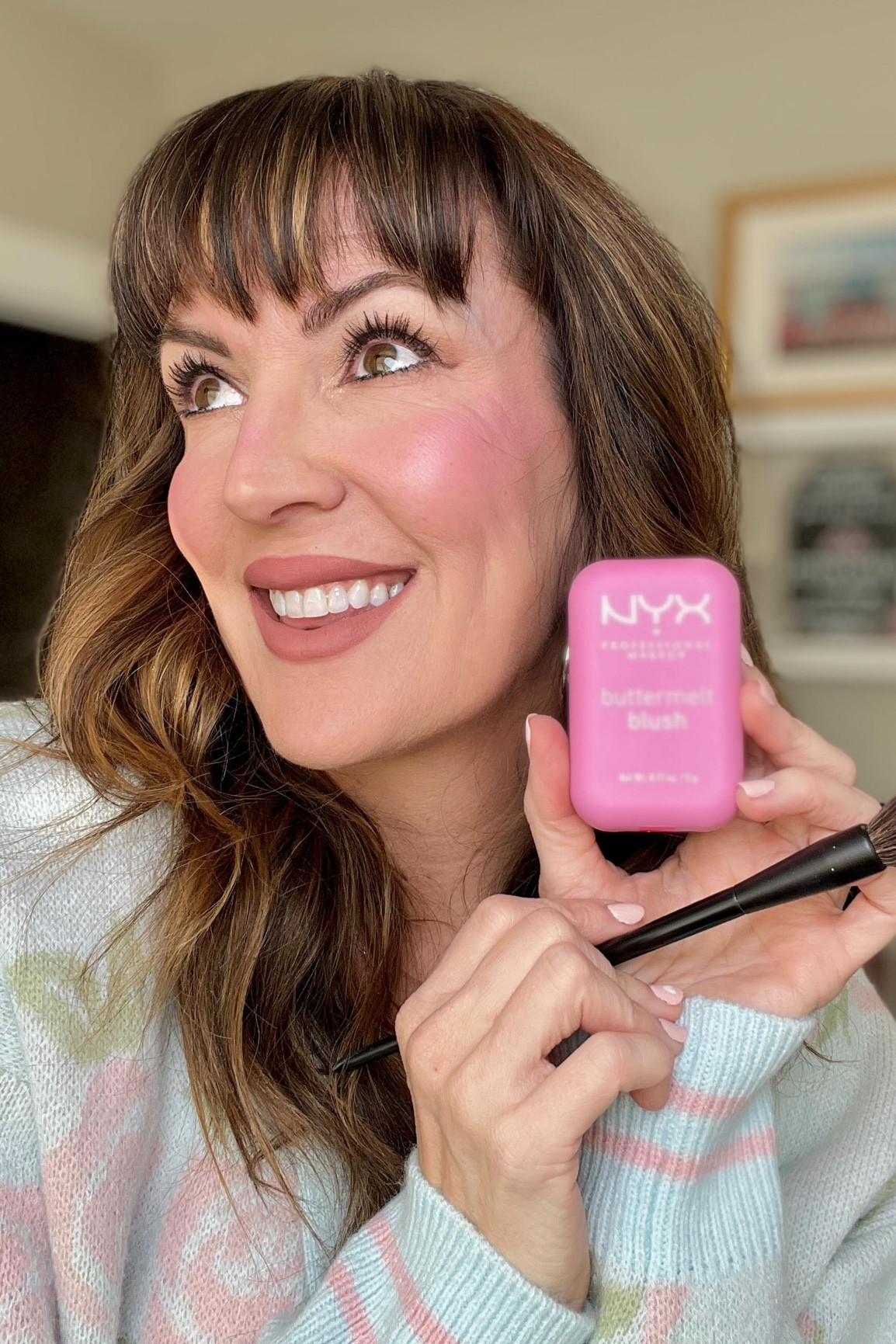 ⚡️🩷I know it’s not the most “natural” color, but it sure is fun and totally brings my face to life! I’m fully in my @dollyparton era now that I just turned 47. She’s known for saying that because of her outgoing personality, that she wants the way she looks (makeup, hair, fashion) to match all of that! And I feel her 💯%. 2025 is going to be more about being bold in my makeup choices, since this creative outlet makes me really happy. 

Different strokes for different folks of course, and some people feel the opposite, and NOT confident in a full face of makeup. 🙈And that’s OK. But a bare faced Jennifer, is an uninspired Jennifer, so I plan on bringing on all the color 🎨 and all the “extra” beauty tips, tricks🪄, and products I can to my page this year. So hop on board if you aren’t afraid of makeup and let’s have some fun! // Oh, and highly recommend these @nyxcosmetics Buttermelt blushes if you’re in the market for a drugstore cheek color. Truly remarkable formula and color options - wearing shade “My Butta Half” here. #nyxcosmetics #blush #pinkcheeks #makeupideas #drugstoremakeup #maturemakeup #nyx #musthavemakeup