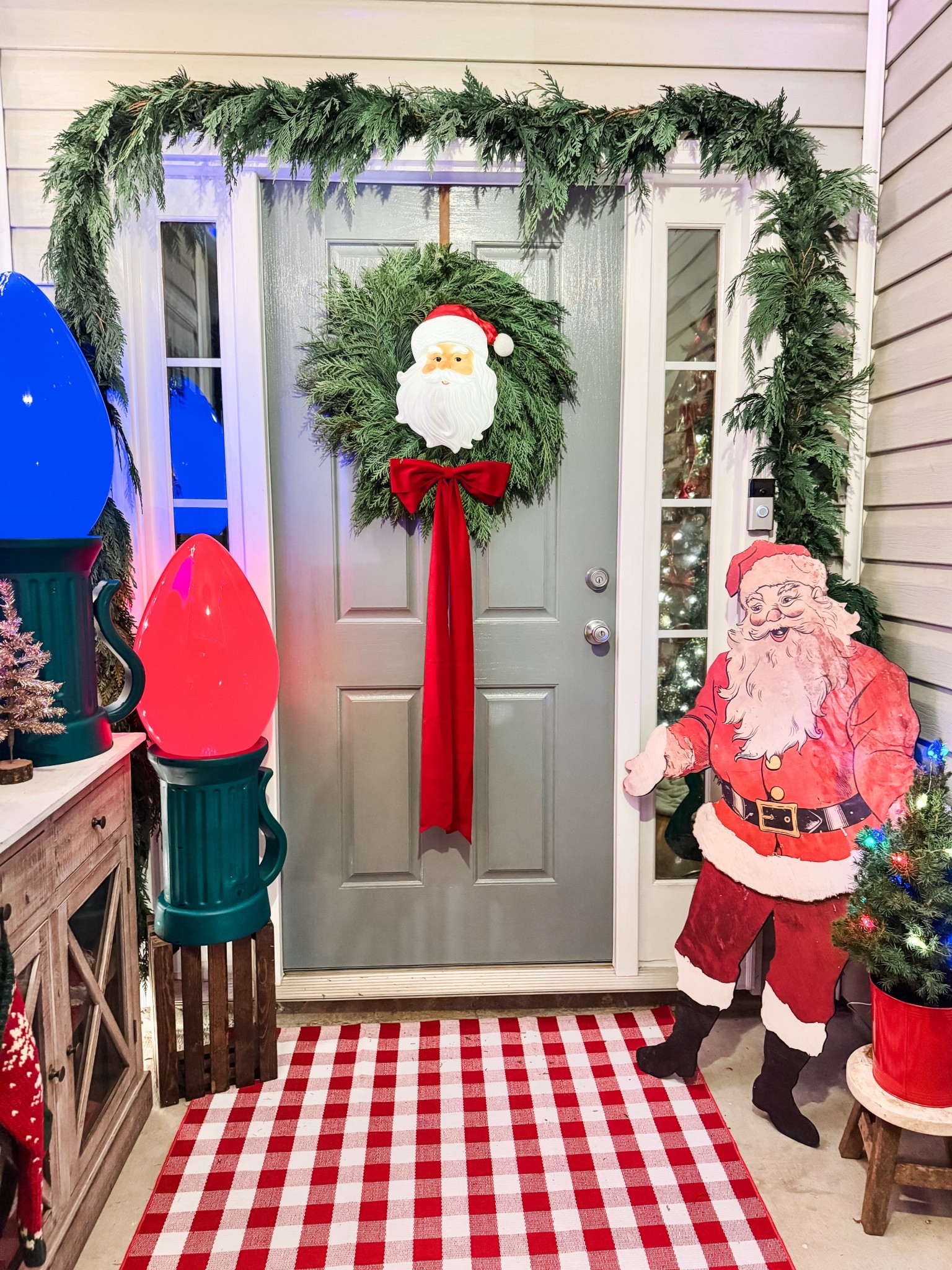 This Santa added the perfect touch to my wreath! We drilled two holes in the the back and used wire to hang it! It’s made to be a tree topper so it would look cute that way too! 

#LTKHome #LTKHoliday #LTKSeasonal