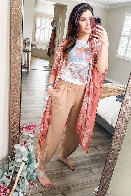 Finally Friday! When you want to feel cozy but need to look put together, these pants are the best. Paired with a graphic tee and a colorful kimono, I feel like sleep but look like work! 
Medium in the pants and tee. 
Kimono is one size 

#LTKOver40 #LTKFindsUnder50 #LTKFindsUnder100