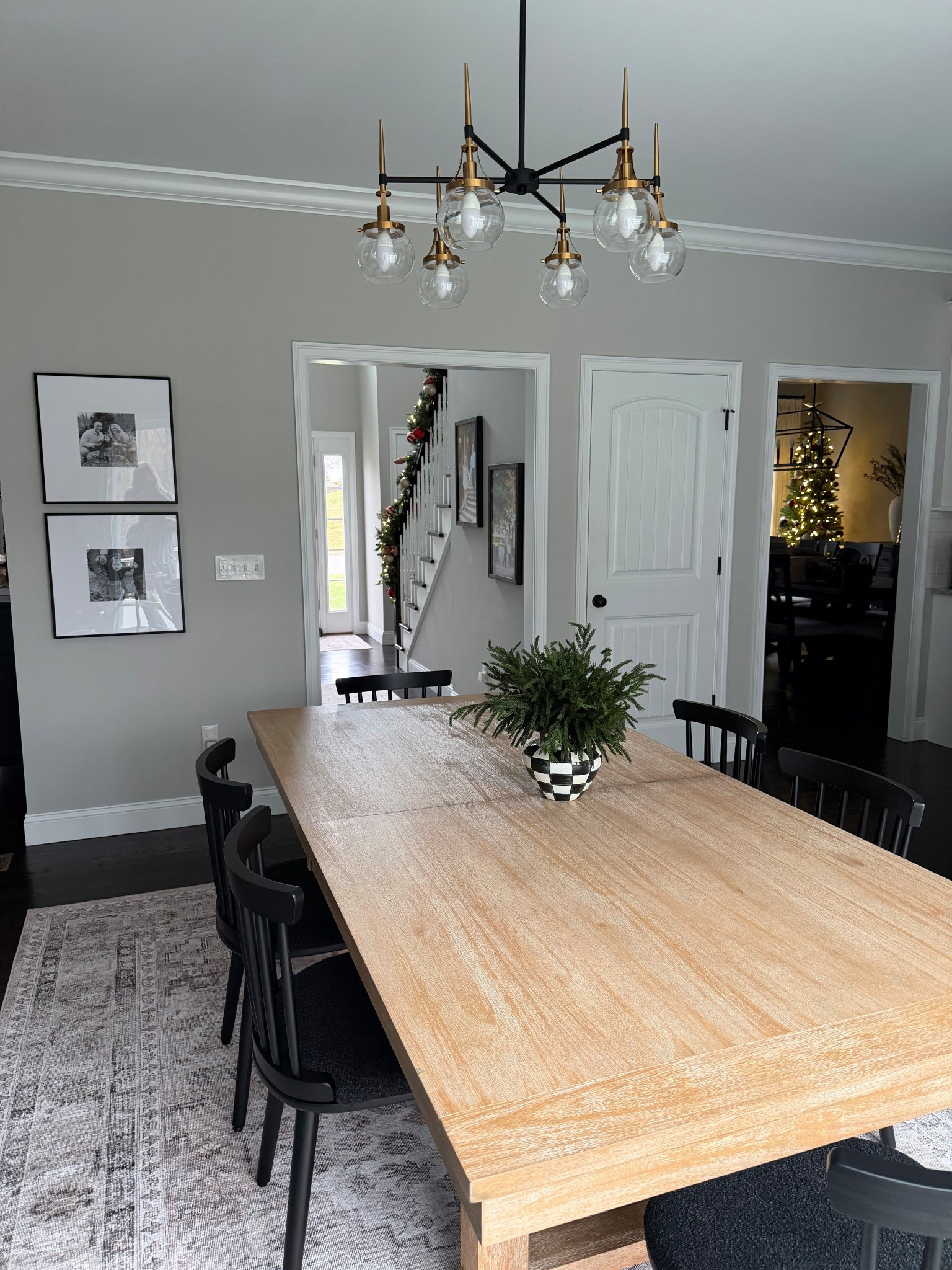 Our updated kitchen table and light 🖤 absolutely love the warmth of a wood kitchen table + black chair combo!

Gold orb light, trinity dining table, wood kitchen table, pottery barn dupe 

#LTKSaleAlert #LTKdayinmylife #LTKHome