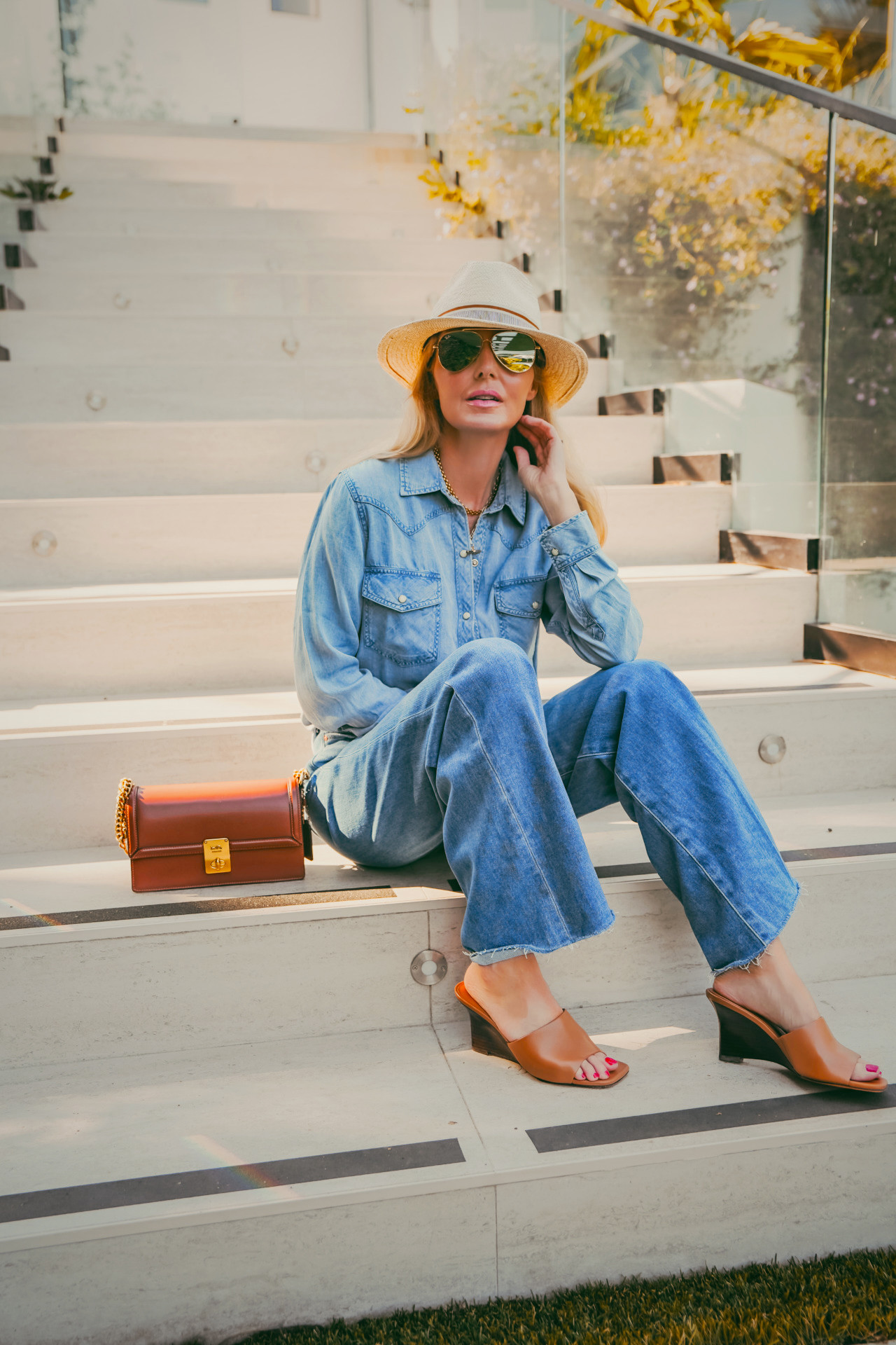 Double denim with cognac accessories is one of those combinations that just works every time!

Paige Anessa wide leg jeans with a Rails chambray top, Rag & Bone straw hat with mirrored aviators, cognac wedge mules, and a cognac chain bag; every element in the warm toned family. Cohesive without being matchy, polished without trying too hard.

#LTKgrwm #LTKootd #LTKOver40