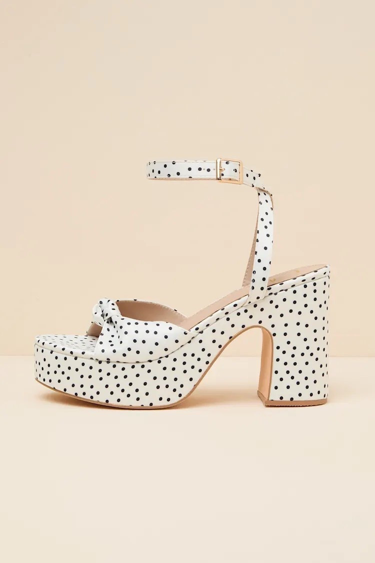 Playful yet refined — the Rosamond white polka dot platform heel sandals feature a knotted design and elevated silhouette, perfect for adding a romantic touch to any look. Under $60.

Keywords: Spring outfits 2026, resort outfits 2026, spring heels, summer heels, spring outfits women, summer outfits women, polka dot heels, ankle strap sandals, party outfits, party heels, resort heels, resort sandal heels, sandal heels, date night heels, party heels, mules 


#LTKWedding #LTKTravel #LTKFestival