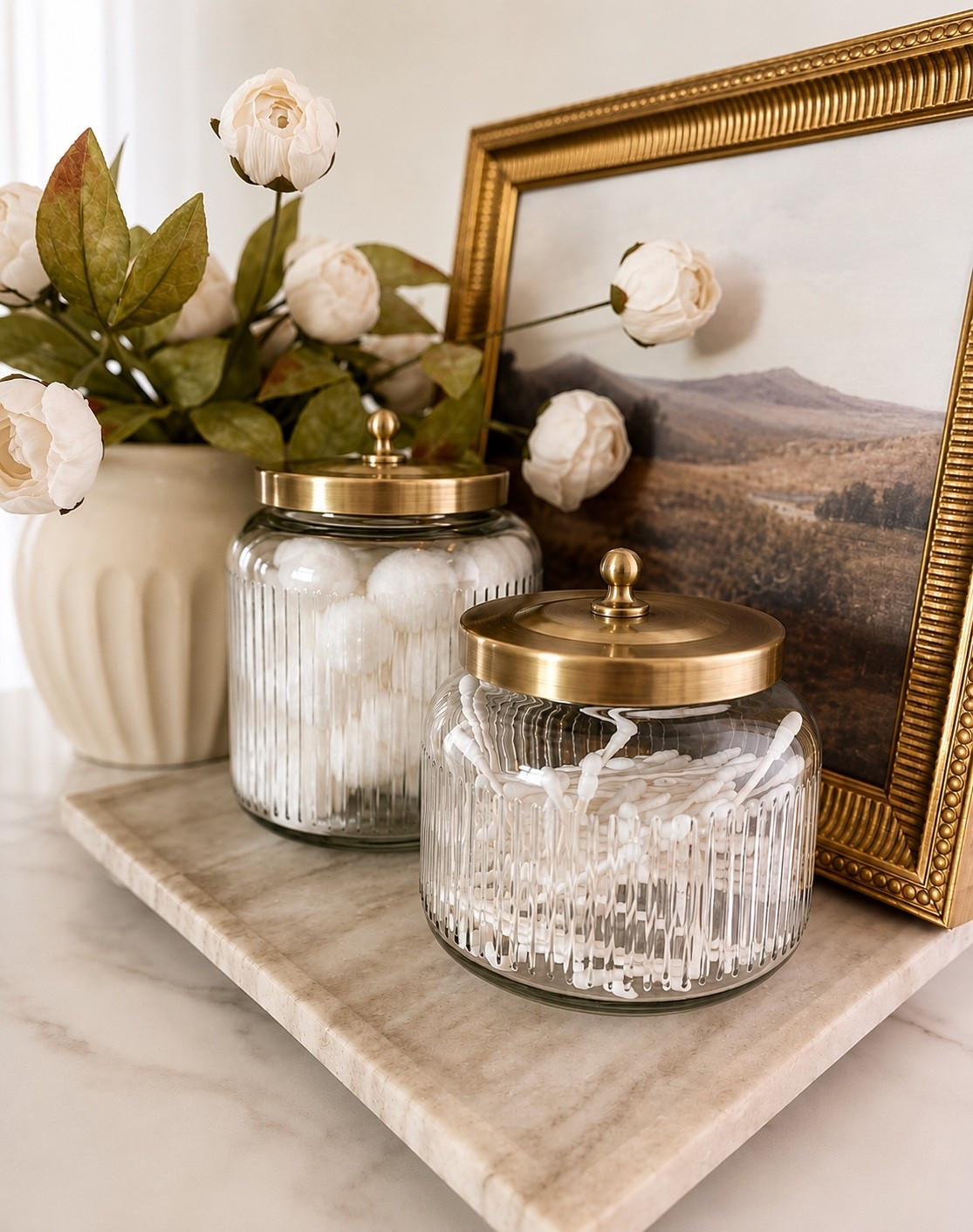Elevate your bathroom with these pretty ribbed glass canisters from Target!  Paired them with this beautiful footed marble tray!  This tray is so versatile- I love using it in my kitchen too!
