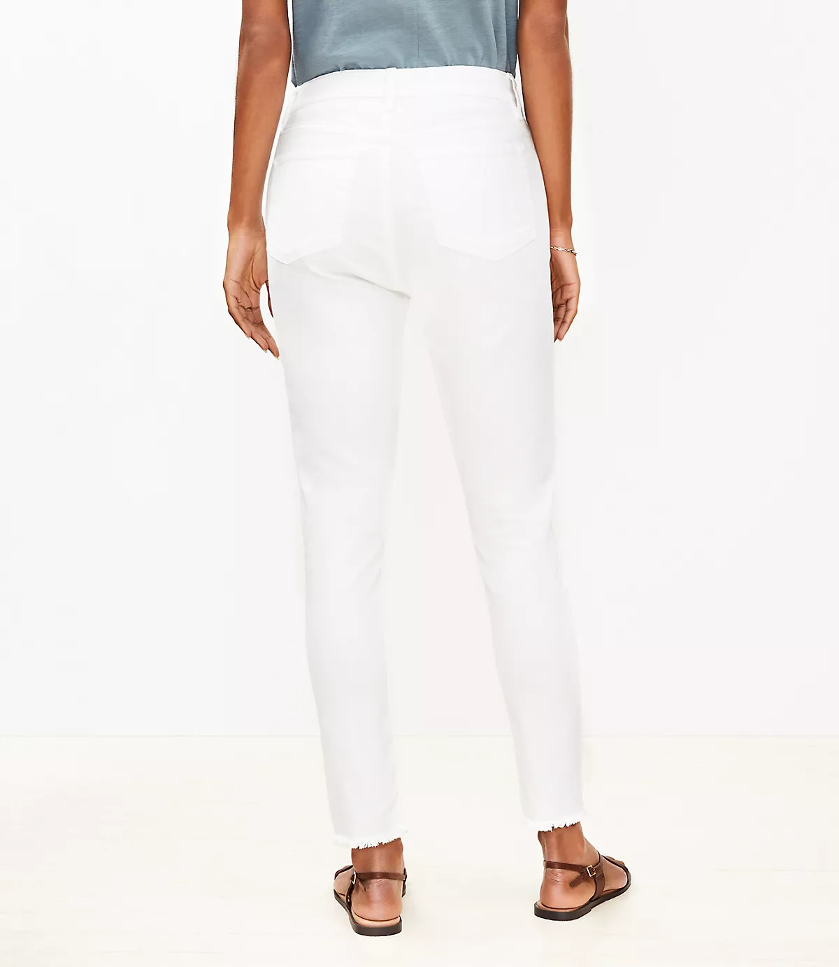Petite Curvy High Rise Frayed Skinny Jeans in White | LOFT