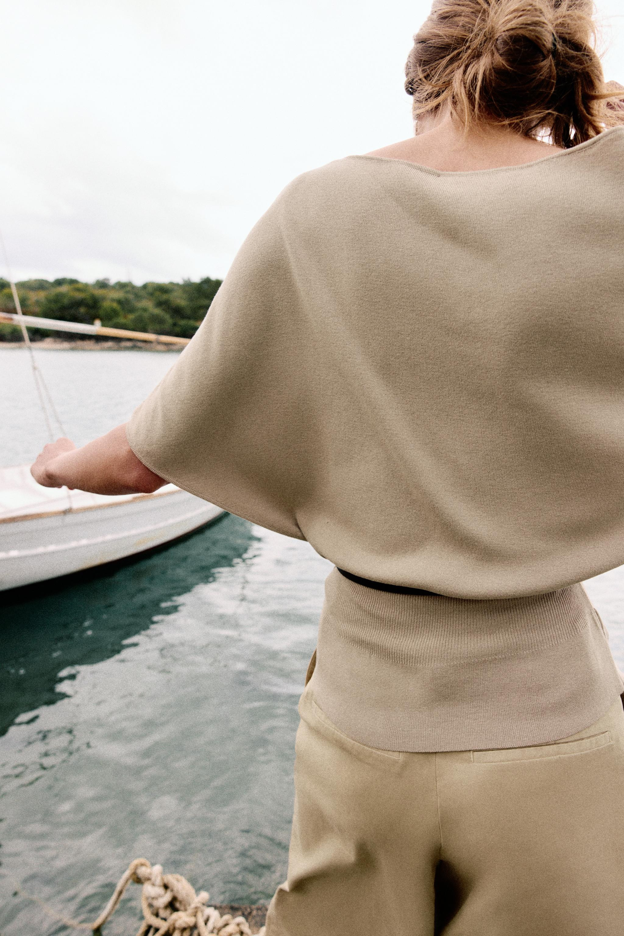 Boat neck top with wide short sleeves. Fitted waist with a slim belt. | Zara US