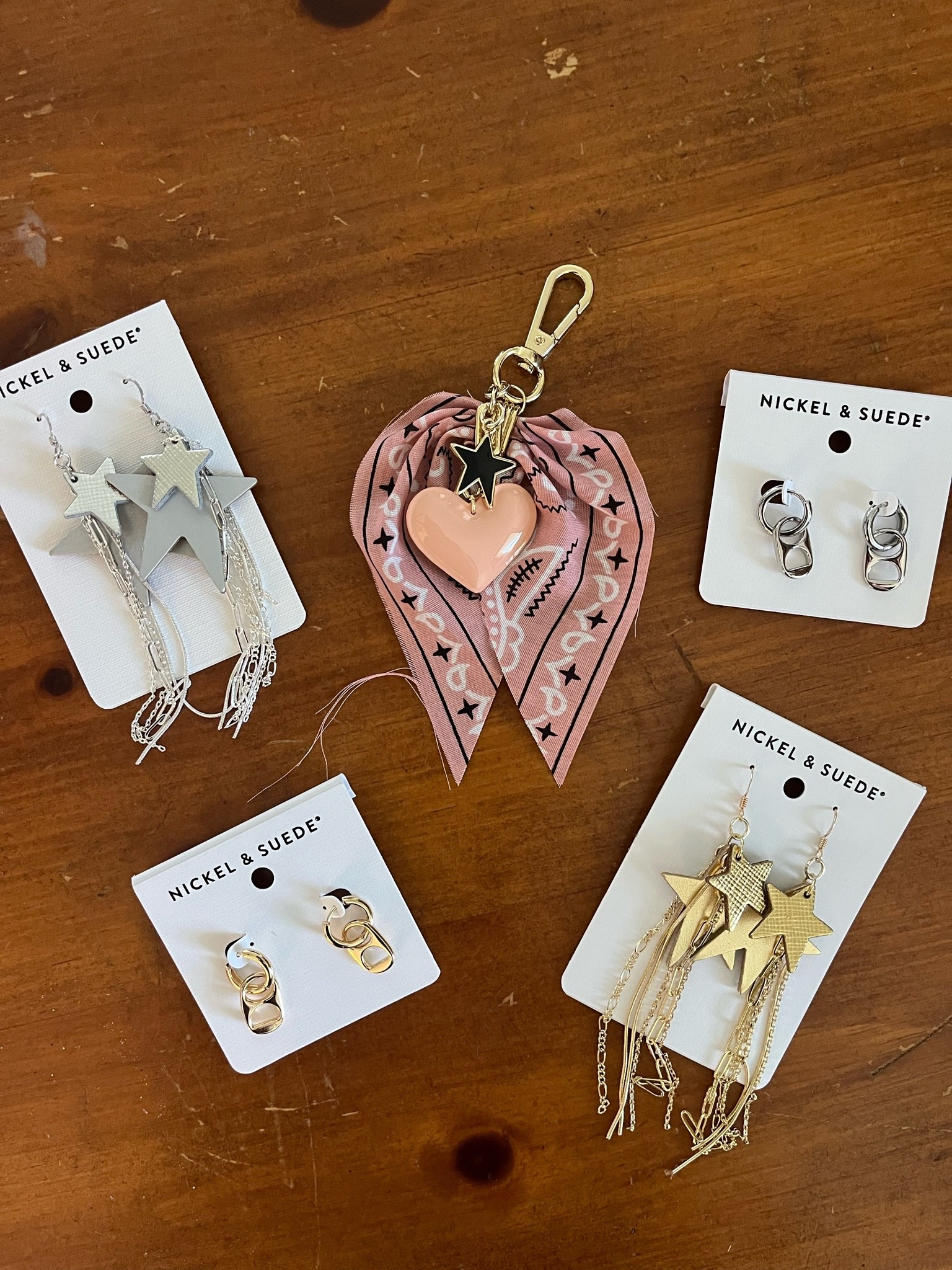 Bandana bag charm and gold & silver earrings!! Love the bottle tabs for a casual look. The stars are definitely a statement piece. So pretty!!!

#LTKSeasonal #LTKootd