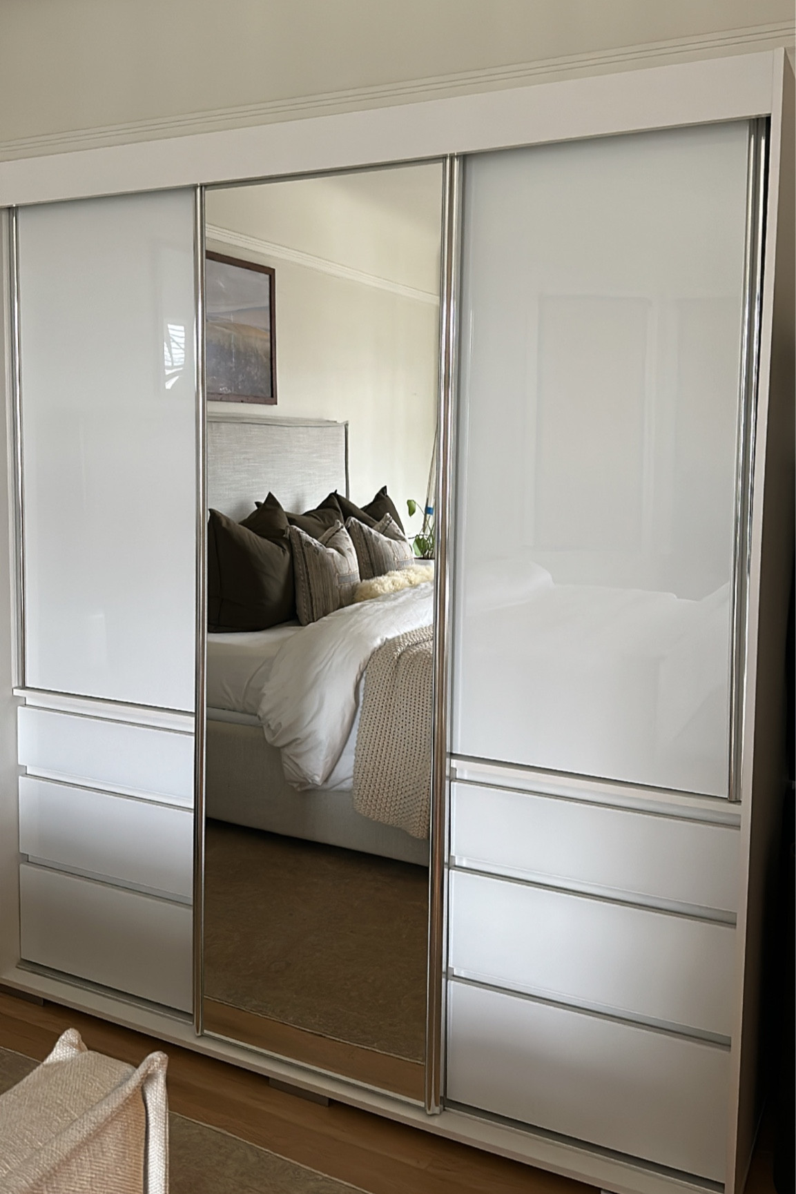 New armoire! Has three longer hanging spaces with 3 drawers on each side. Two shelves on the lower half behind the sliding mirror for shoes and bags. We love it! Definitely tough to put together in our crammed space but the quality is actually really good.

#LTKhome