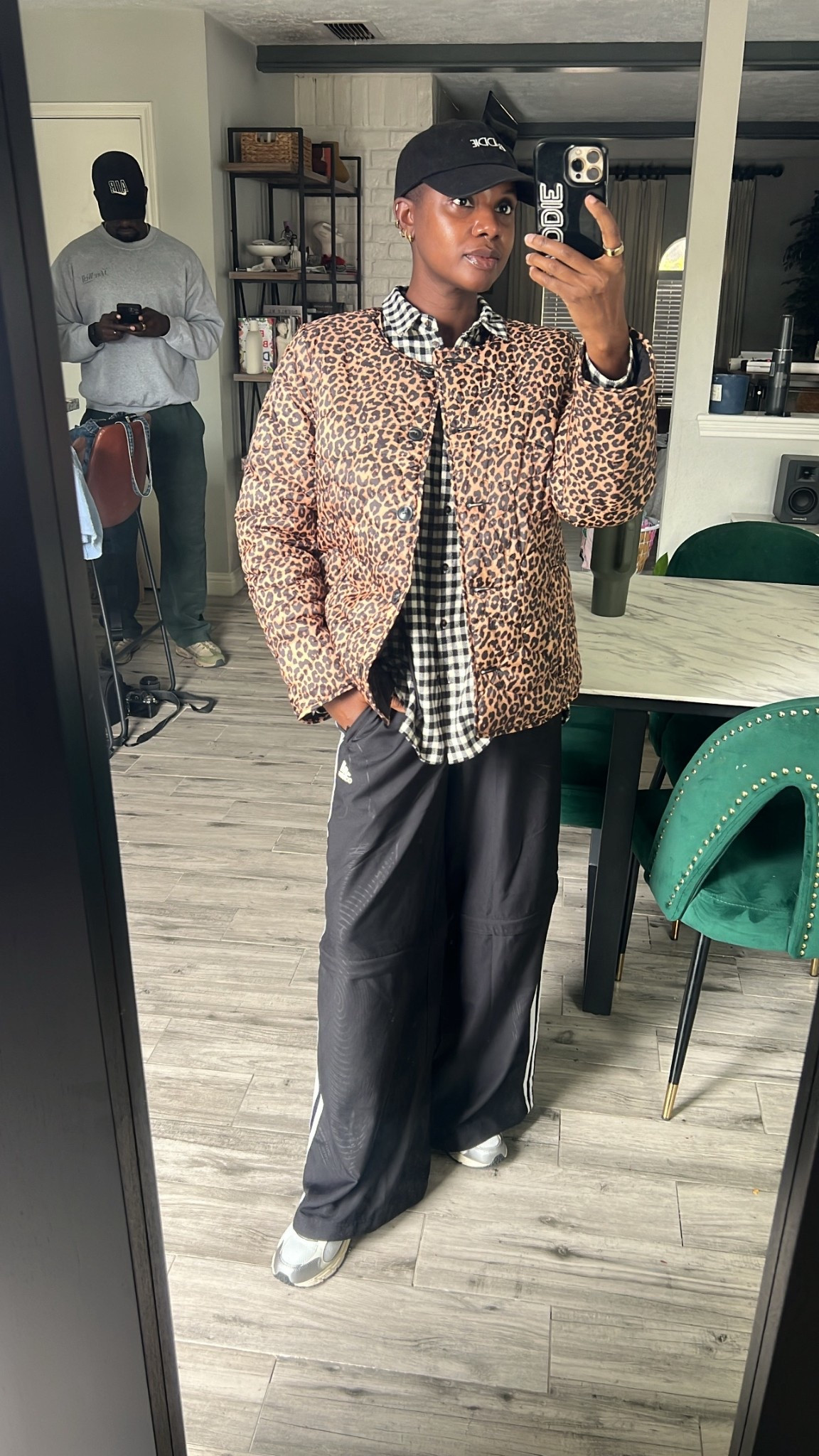 Winter outfit with pattern play! Reversible leopard puffer jacket, black & white gingham shirt, black adidas sweater pants, black dad hat, silver & cream new balance sneakers. Great travel outfit !

#LTKOver40 #LTKdayinmylife #LTKTravel