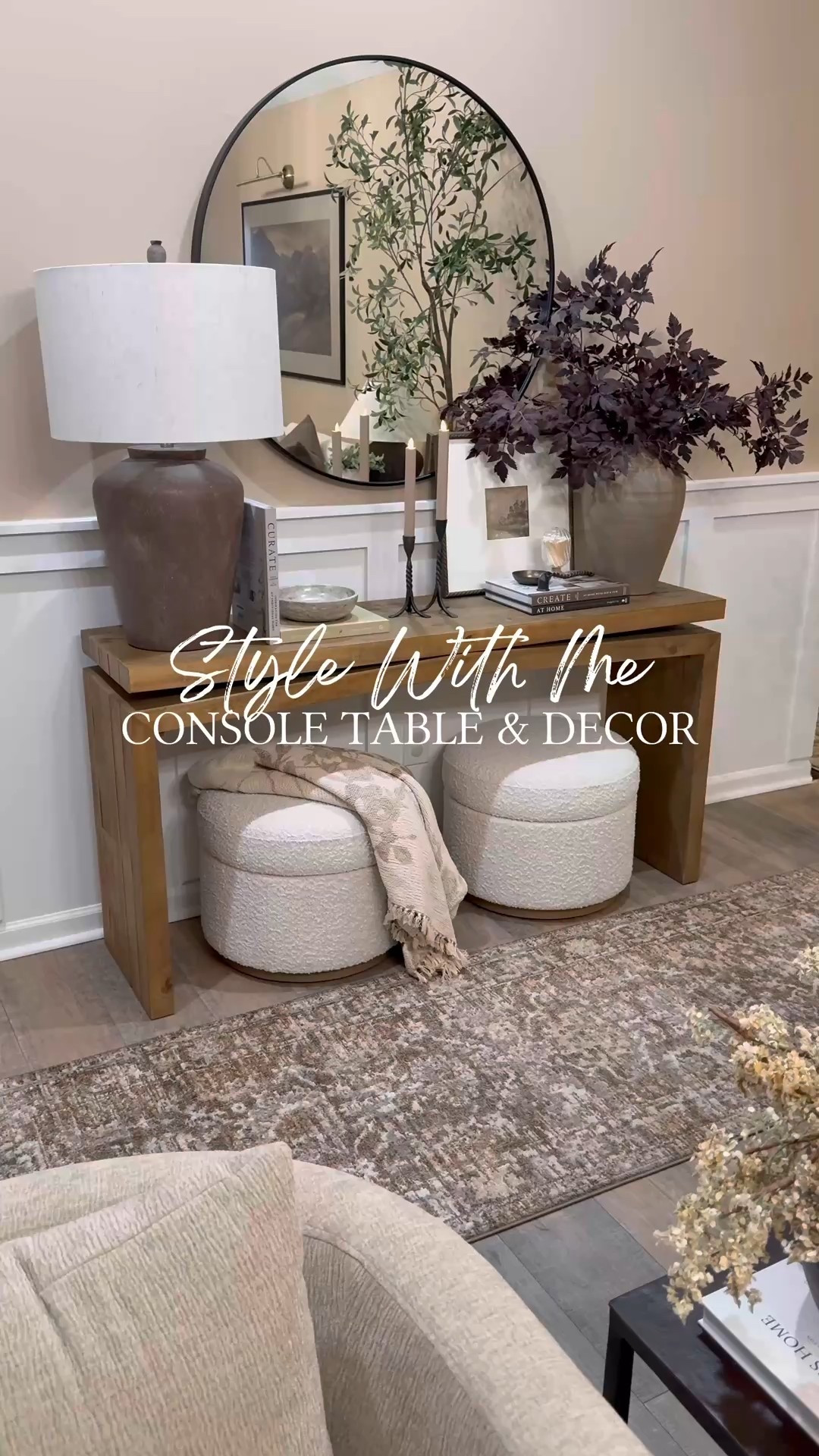 Style With Me Console Table & Decor

Follow @farmtotablecreations on Instagram for more neutral home inspiration 🤍

Sharing a closer look at this cozy entryway moment. ✨ I layered this warm wood console with a round black mirror, oversized ceramic lamp, stacked neutral books, taper candles, and a moody plum arrangement for a soft seasonal touch. The two textured storage ottomans tucked underneath add function and warmth while keeping everything clean and balanced.

This is one of those spaces that feels elevated but still practical — perfect for an entryway, hallway, or even behind a sofa. Every piece is neutral, versatile, and easy to mix into your home.

#consoletable #entrywaydecor #roundmirror #tablelamp #ottoman #arearug #boucle #neutraldecor #homedecor #modernorganic

#LTKdayinmylife #LTKHome #LTKSaleAlert