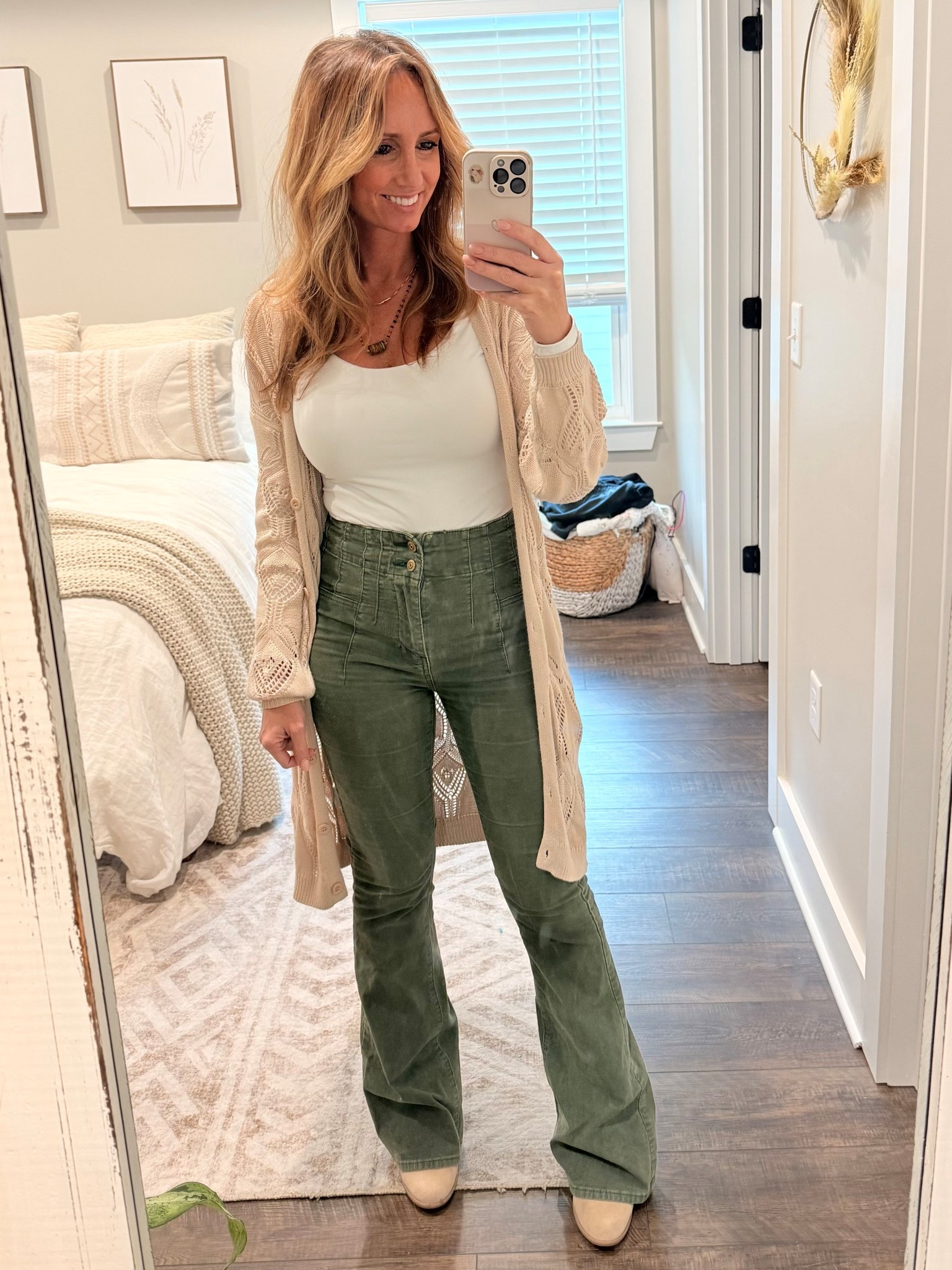 Casual business outfit of the day for the office 

Free People Jade Flares: $98
Amazon Double lined, long sleeve bodysuit: $20
Amazon long cardigan: similar linked

#LTKSeasonal #LTKWorkwear #LTKFindsUnder100