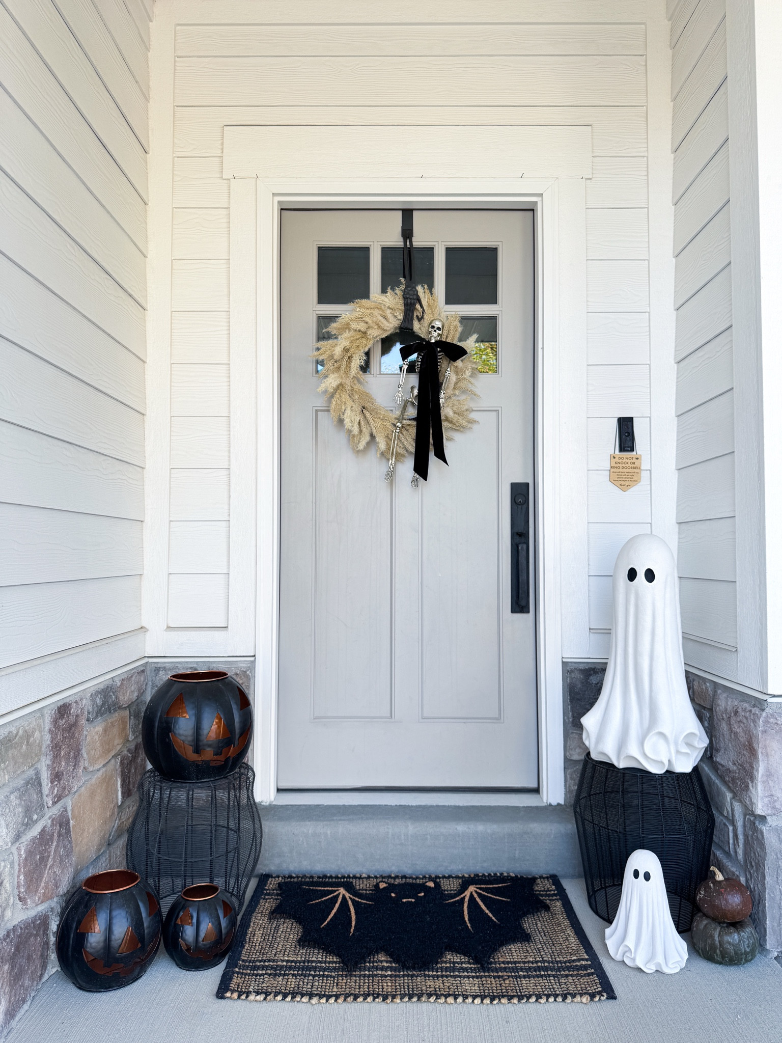 Just missing real pumpkins & mums 

Ghosts are from Home Goods, tagging similar. 

Halloween Front Porch Decor - Halloween Front Porch 

#LTKHome #LTKHalloween #LTKSeasonal