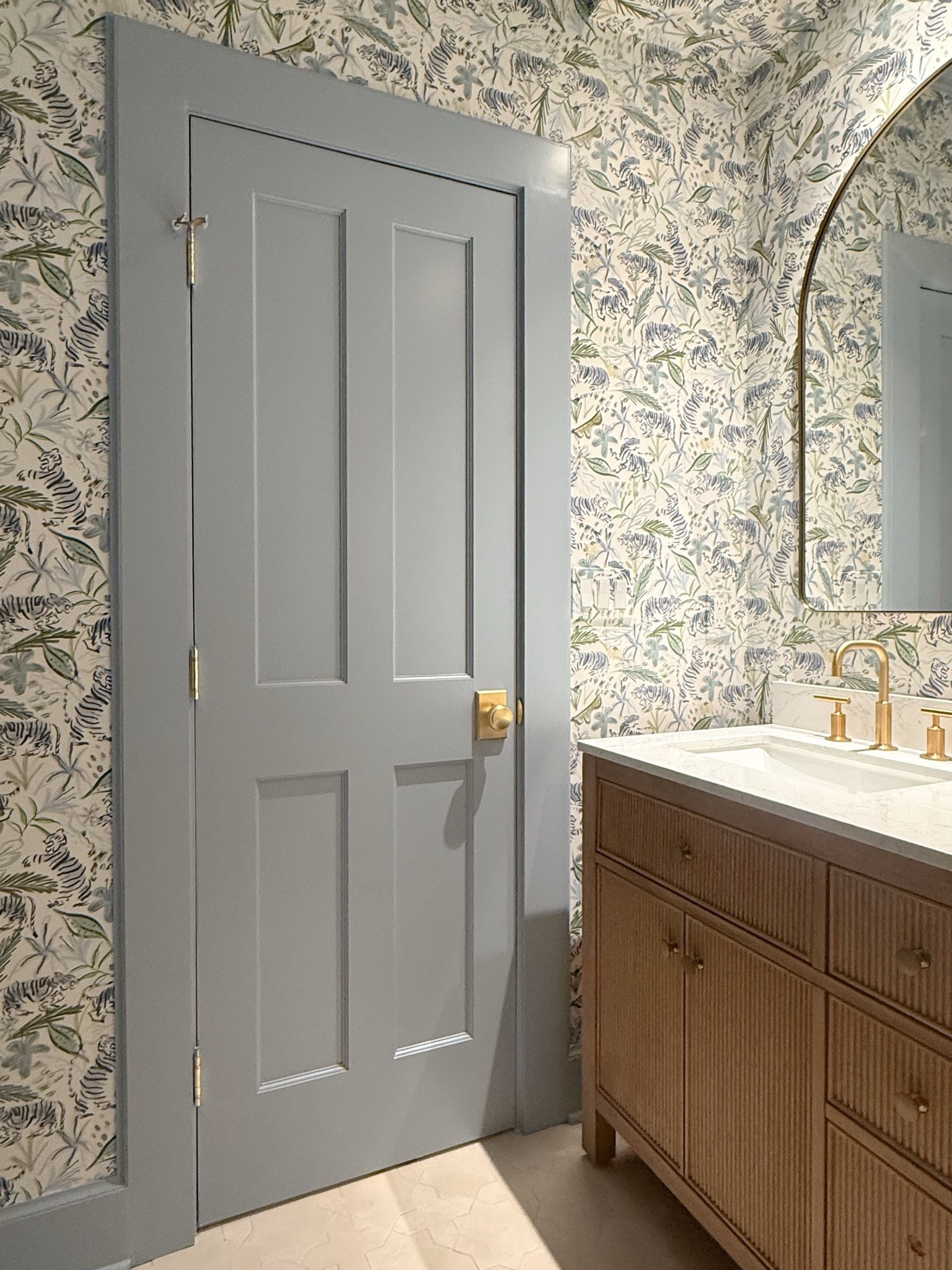 The prettiest powder room I’ve ever seen, if I do say so myself! We color drenched the walls, trim and door in the prettiest shade of blue and wallpapered all of the walls. Brass accents, the perfect vanity and statement lighting! 

Bathroom inspo, bathroom design, wallpaper inspo, Wayfair, before and after, modern coastal, statement wallpaper

#LTKHome #LTKdayinmylife #LTKmorningroutine