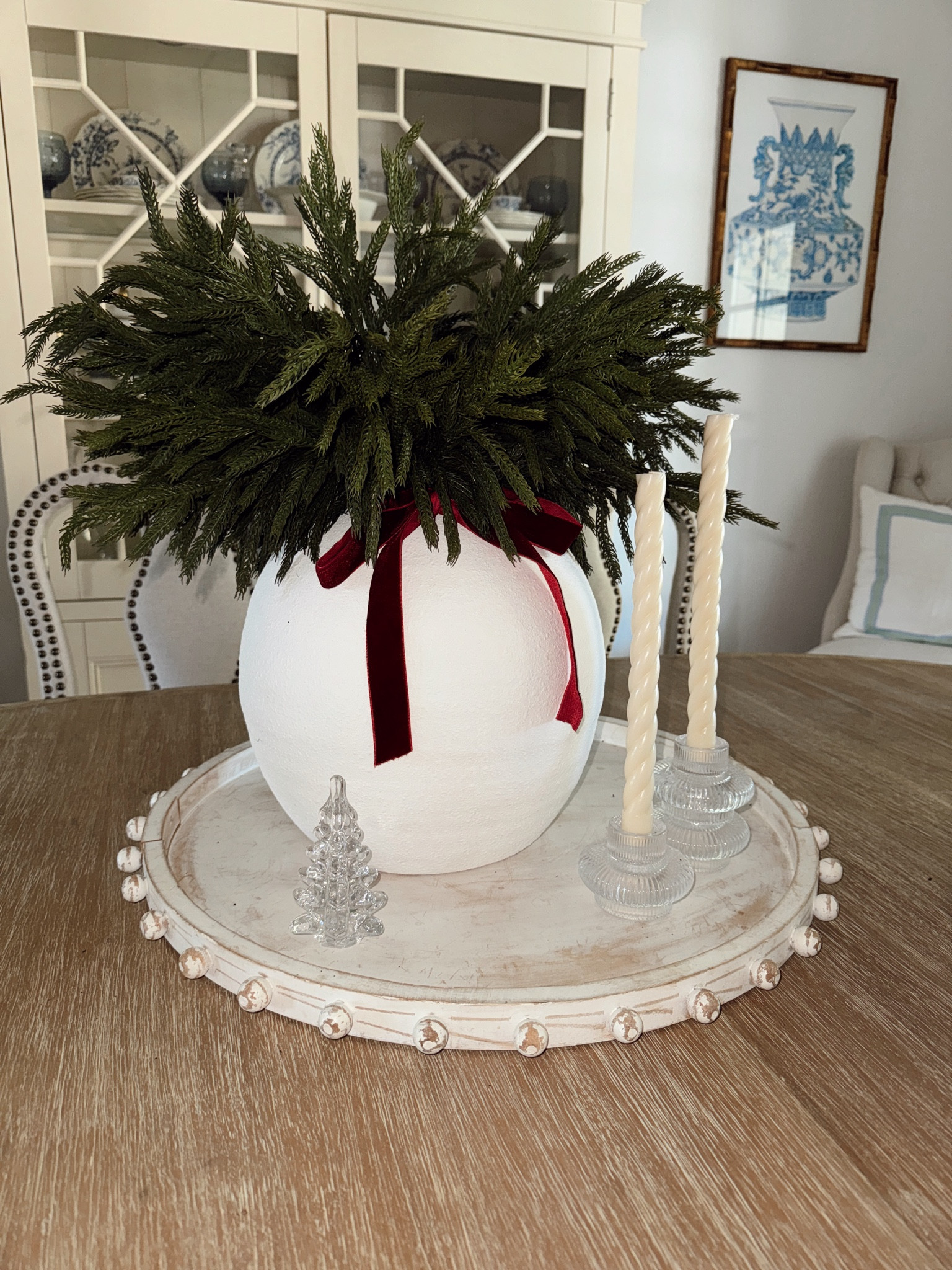 Holiday table center pieces : a simple vase + filler stems for a natural look + elevated with crystal candle holders & a mini tree  

#LTKHome #LTKHoliday #LTKStyleTip