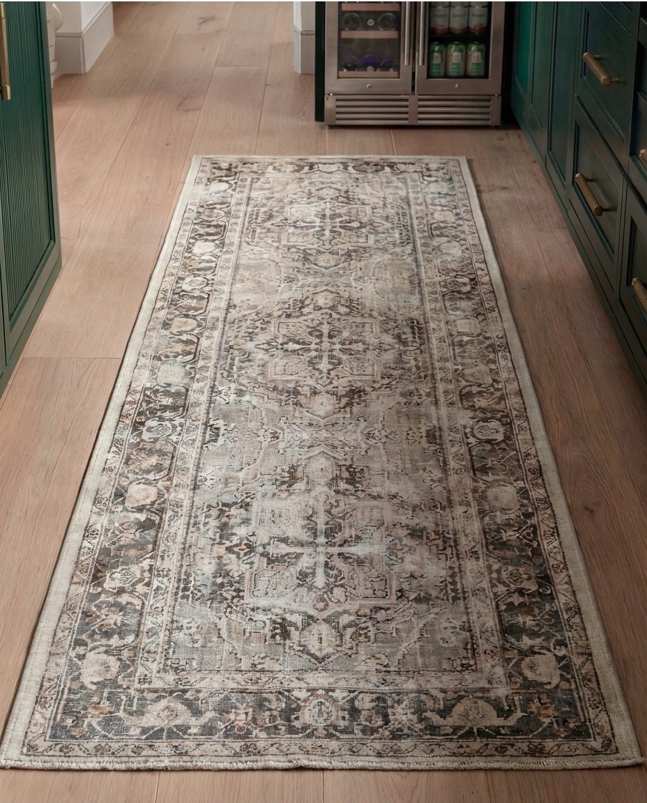 Shop the Look:
• Deep green paneled cabinetry
• Brass cabinet pulls + knobs
• Marble countertops (soft gray veining)
• Glass-front upper cabinets
• Built-in beverage/wine fridge
• Vintage-style runner rug (neutral tones)
• White globe pendant lights
• Exposed wood ceiling beams
• Open wood shelving
• Clear glassware set
• Ceramic vase with branches
• Countertop coffee machine
• Stoneware mugs + tray
• Light wood flooring
• Arched doorway with framed artwork
• coffee machine
• brass gold faucet 
• green vase
• letter bistro cup 
• globe pendant light 
Brass wall sconce 
Brass hand pulls

#LTKSaleAlert #LTKHome