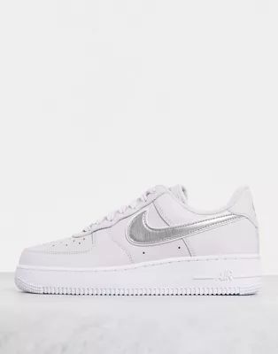 Nike Air Force 1 '07 essential trainers in purple and metallic silver swoosh | ASOS (Global)