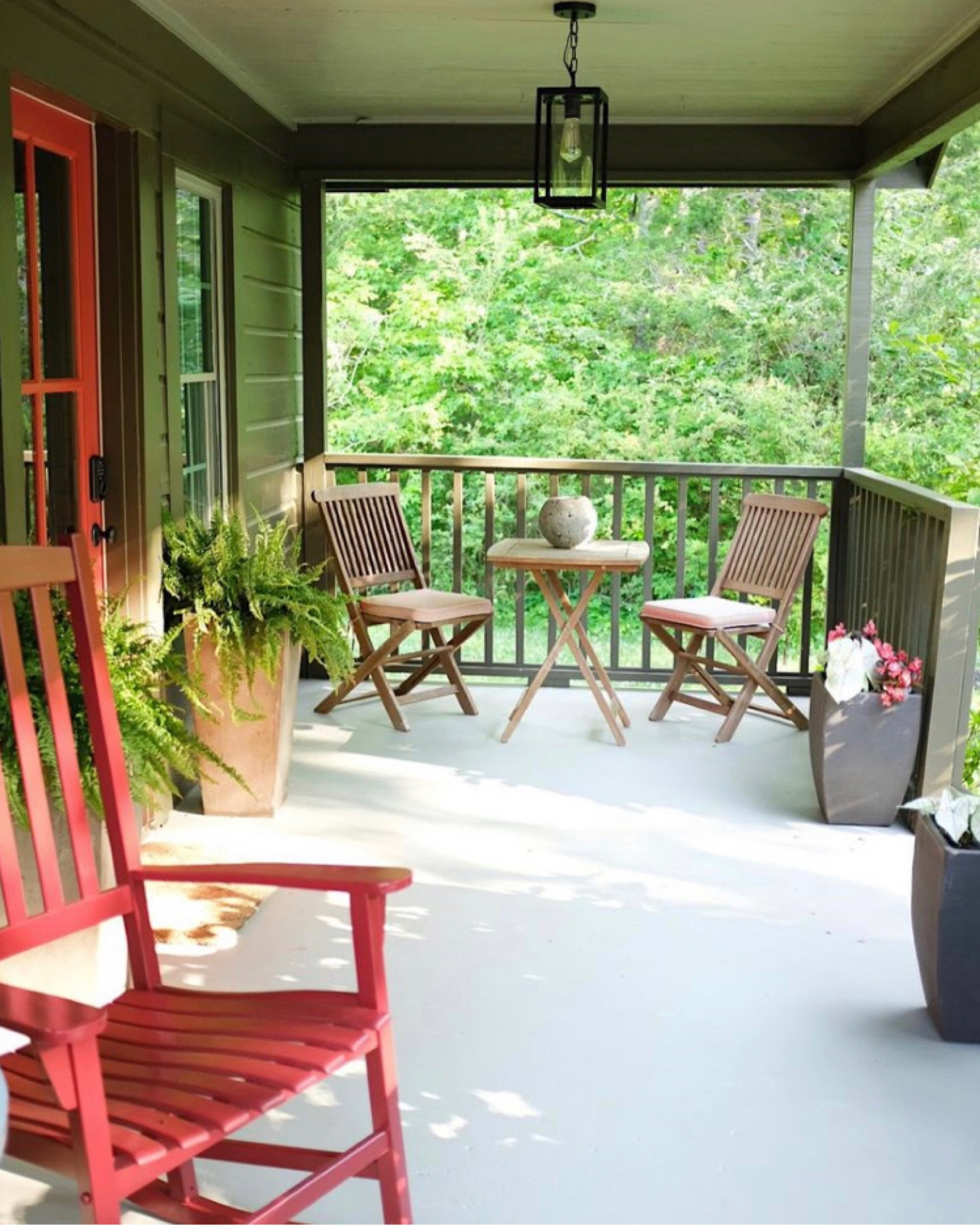 Cottage porch. Rocking chairs. Patio light fixture. Patio table and chairs. Modern planters. 

#LTKSeasonal #LTKhome