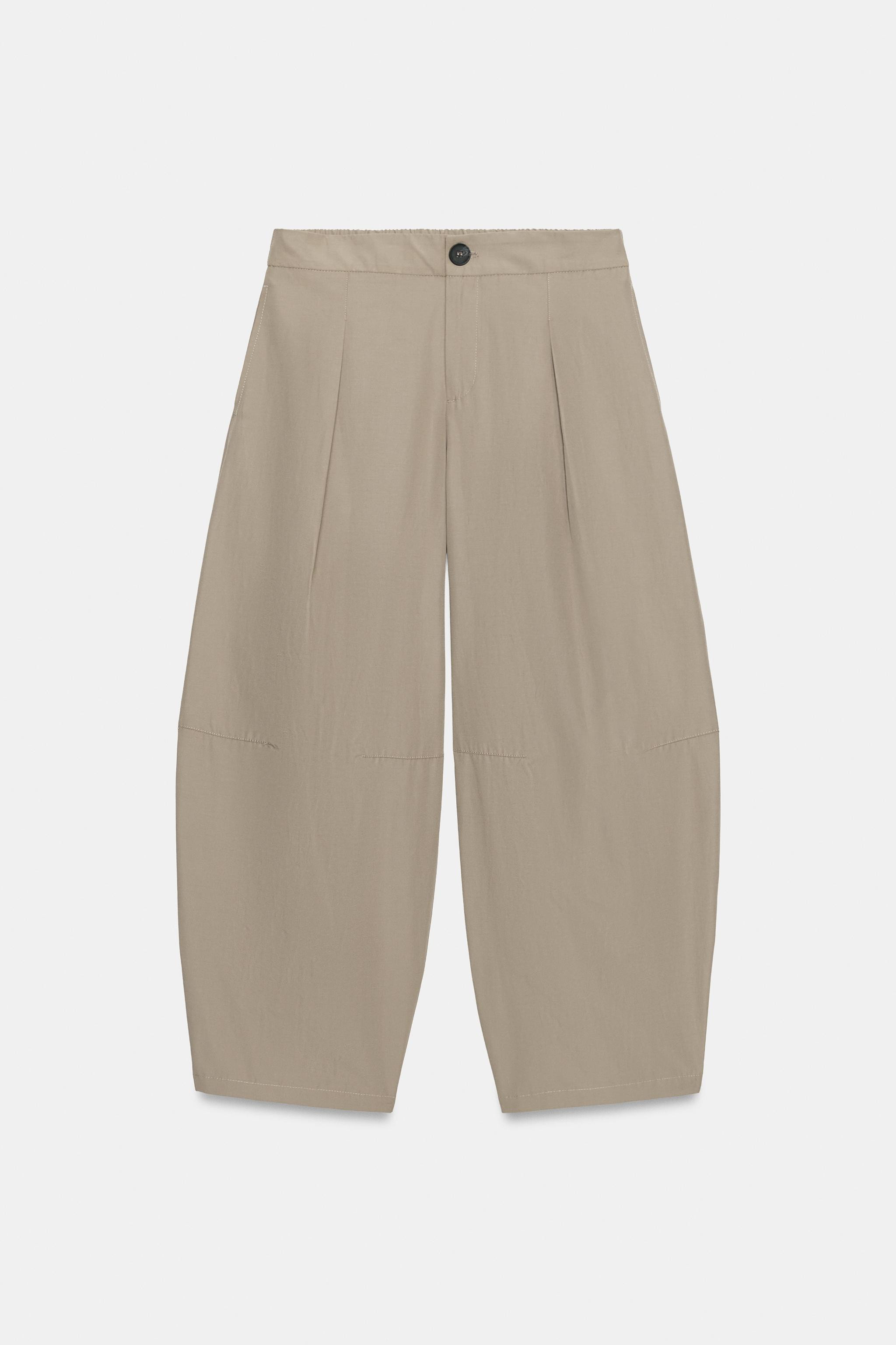 Model height: 178 cmMid-waist trousers featuring an elasticated back and front darts. Includes fr... | Zara UK