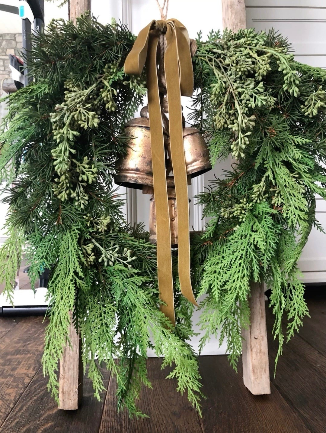 This is one of my favorite holiday wreaths and it’s back for the season. This is the 22”
and it goes on my range hood. See my reel tutorial on how I attached the bells and ribbon. 

 #LTKSeasonal #LTKHome #LTKSaleAlert