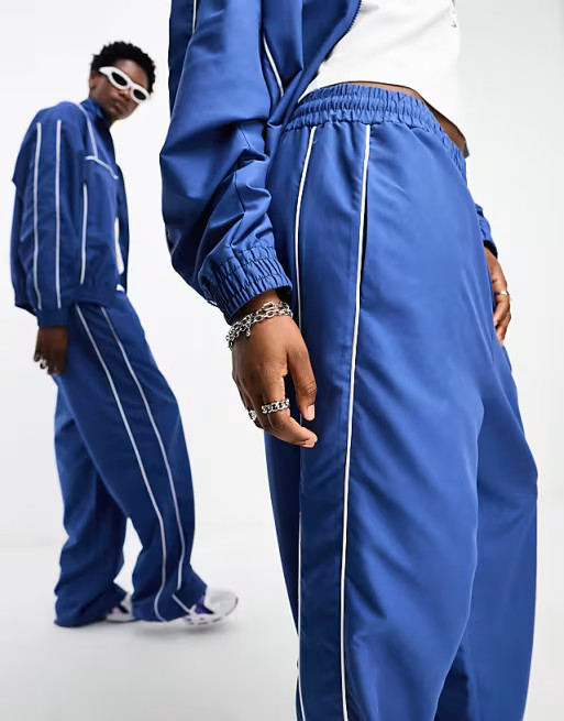 COLLUSION Unisex track pants in blue - part of a set | ASOS (Global)