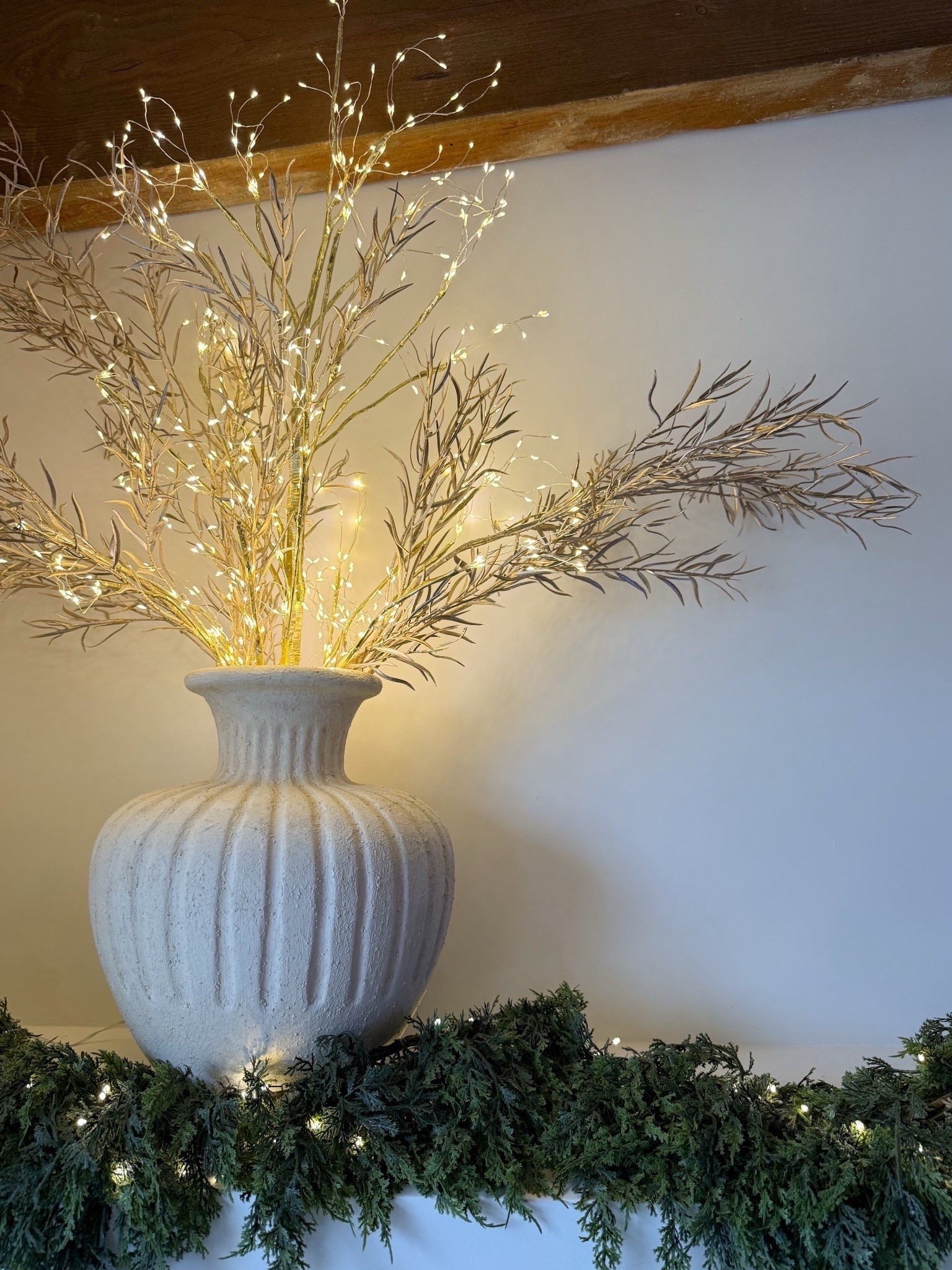 I used this gold Amazon lit tree and didn’t attach the base to style it with these gorgeous champagne stems for a fun holiday arrangement!

#LTKHome #LTKSeasonal #LTKHoliday