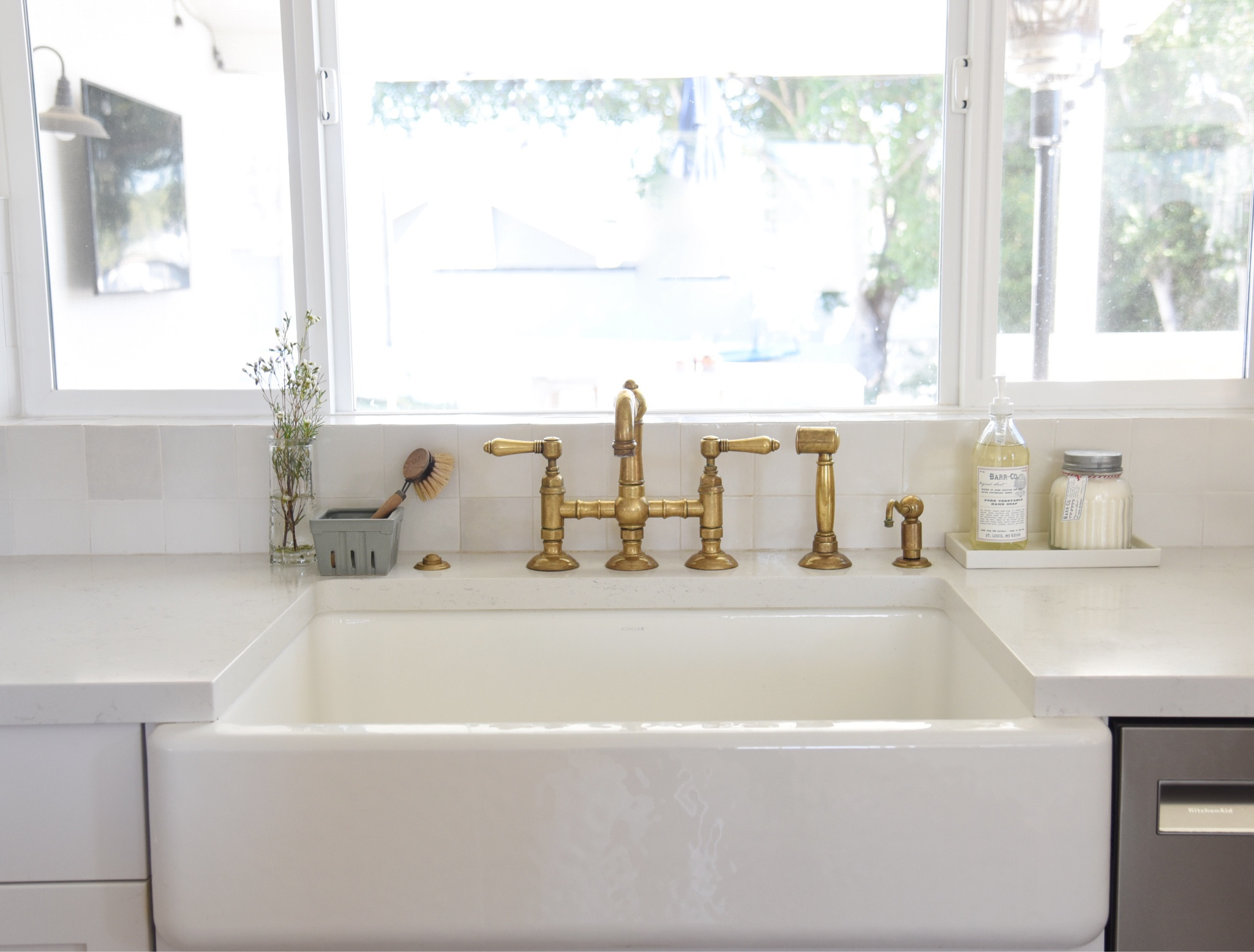 Farmhouse sink paired with brass faucet.  Berry bowl and dish brush are from peony + olive 
www.peonyandolive.com

#LTKhome